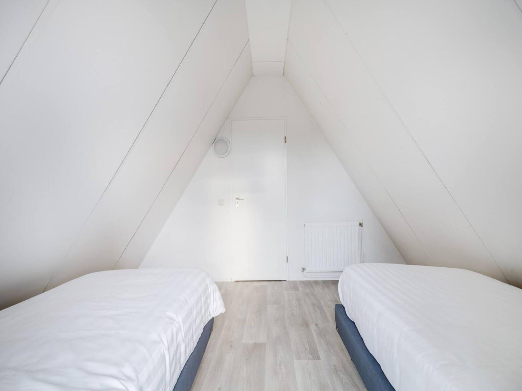 Een slaapkamer van 118 | Rietzanger | Sfeervol ingerichte bungalow in Den Haag