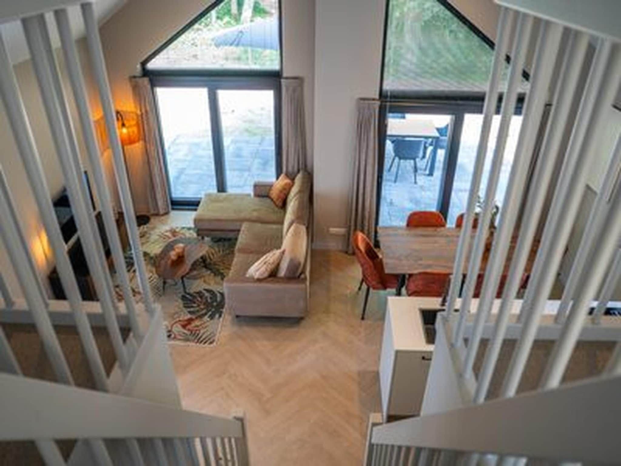 De woonkamer van Ecovilla Boszicht Luxe in Oirschot