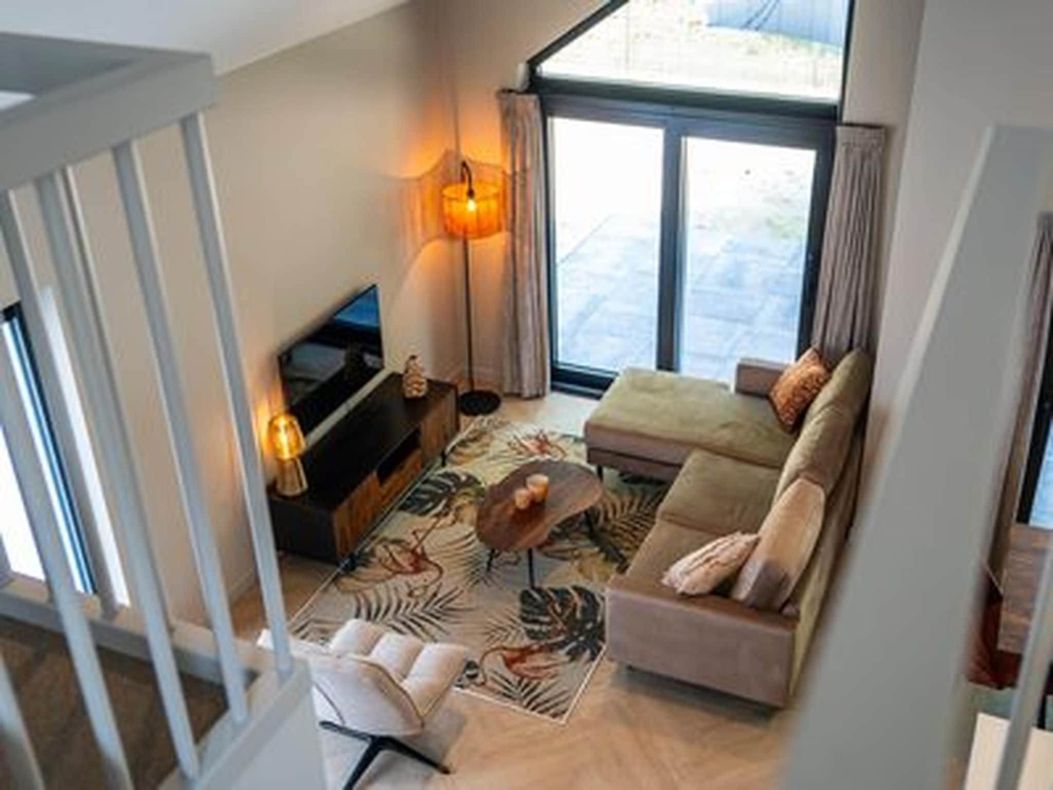 De woonkamer van Ecovilla Boszicht Luxe in Oirschot