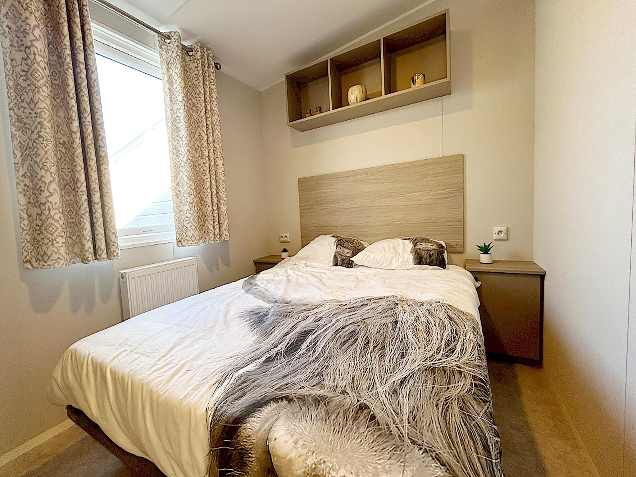 Een slaapkamer van Comfort Chalet in Hollum