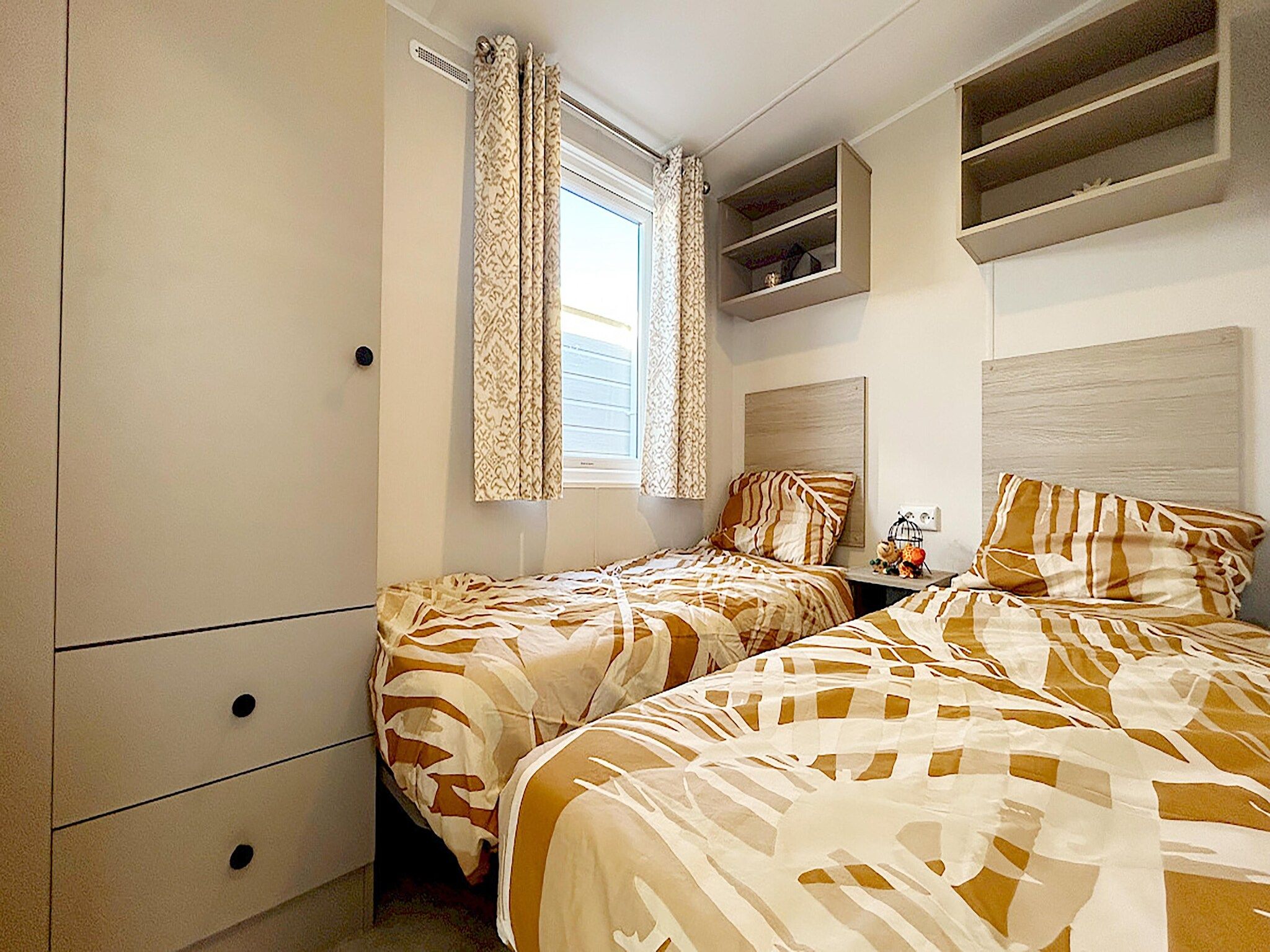 Een slaapkamer van Comfort Chalet in Hollum