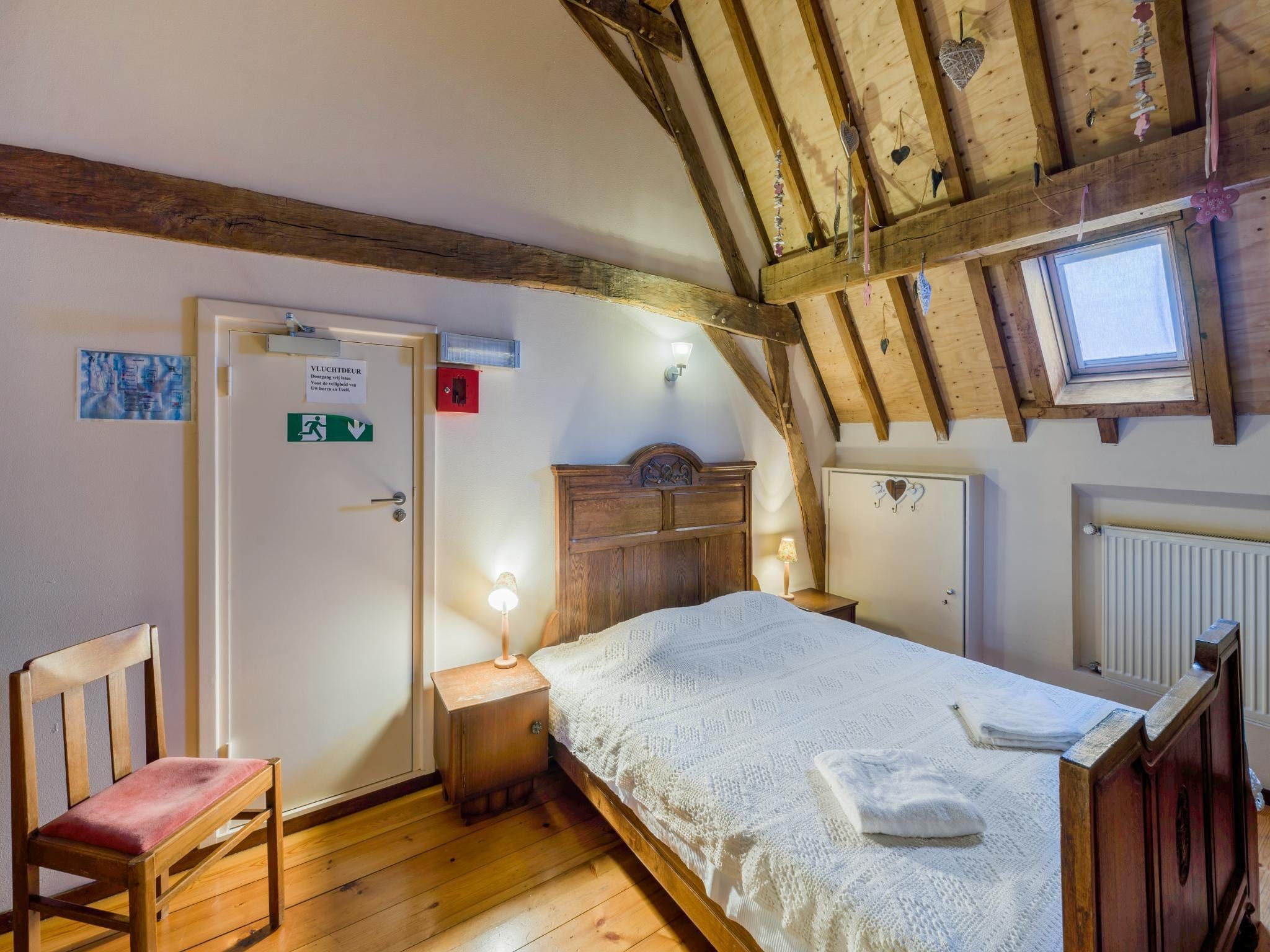 Een slaapkamer van Meschermolen 12 in Mesch-Eijsden