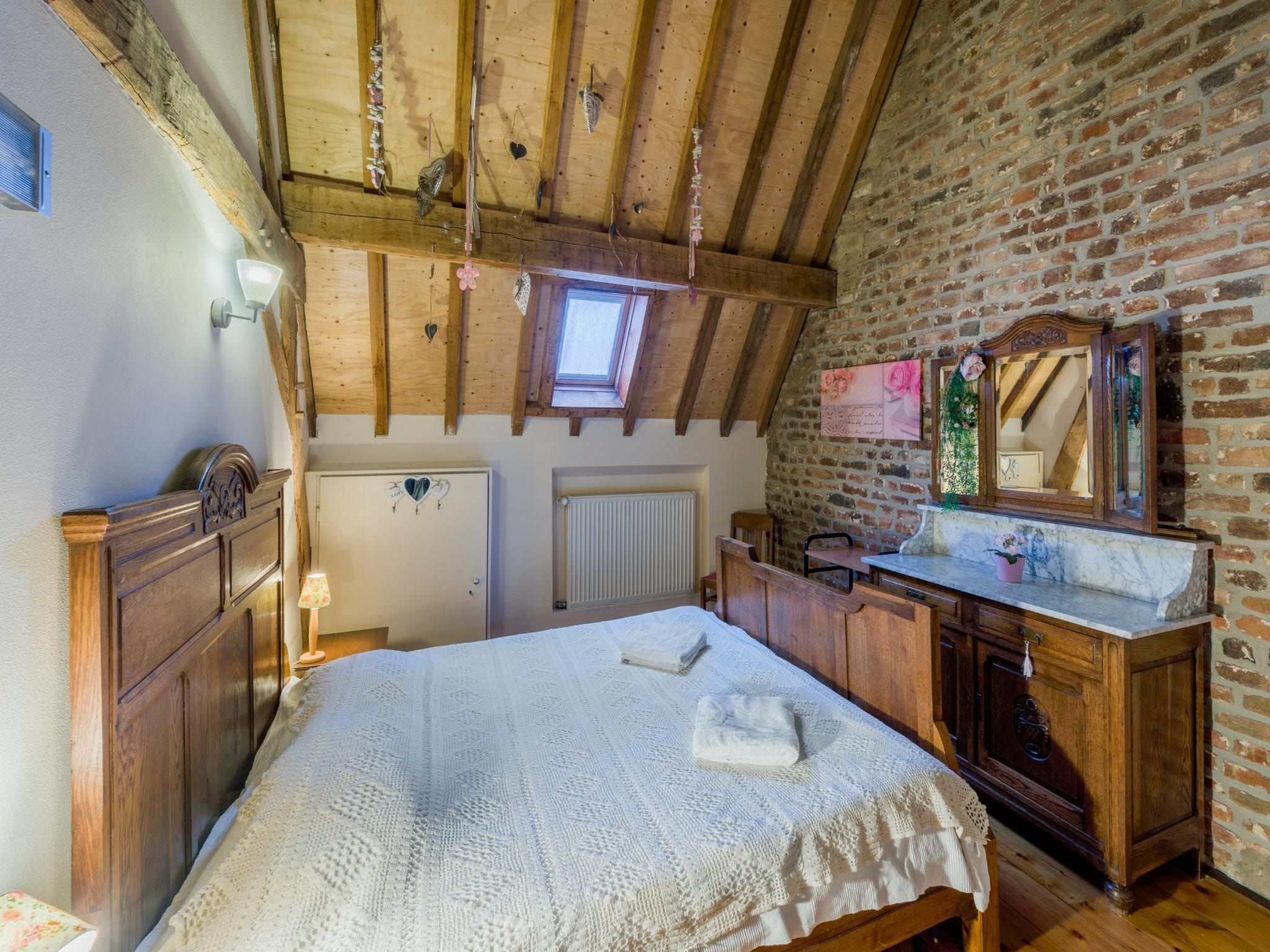 Een slaapkamer van Meschermolen 12 in Mesch-Eijsden