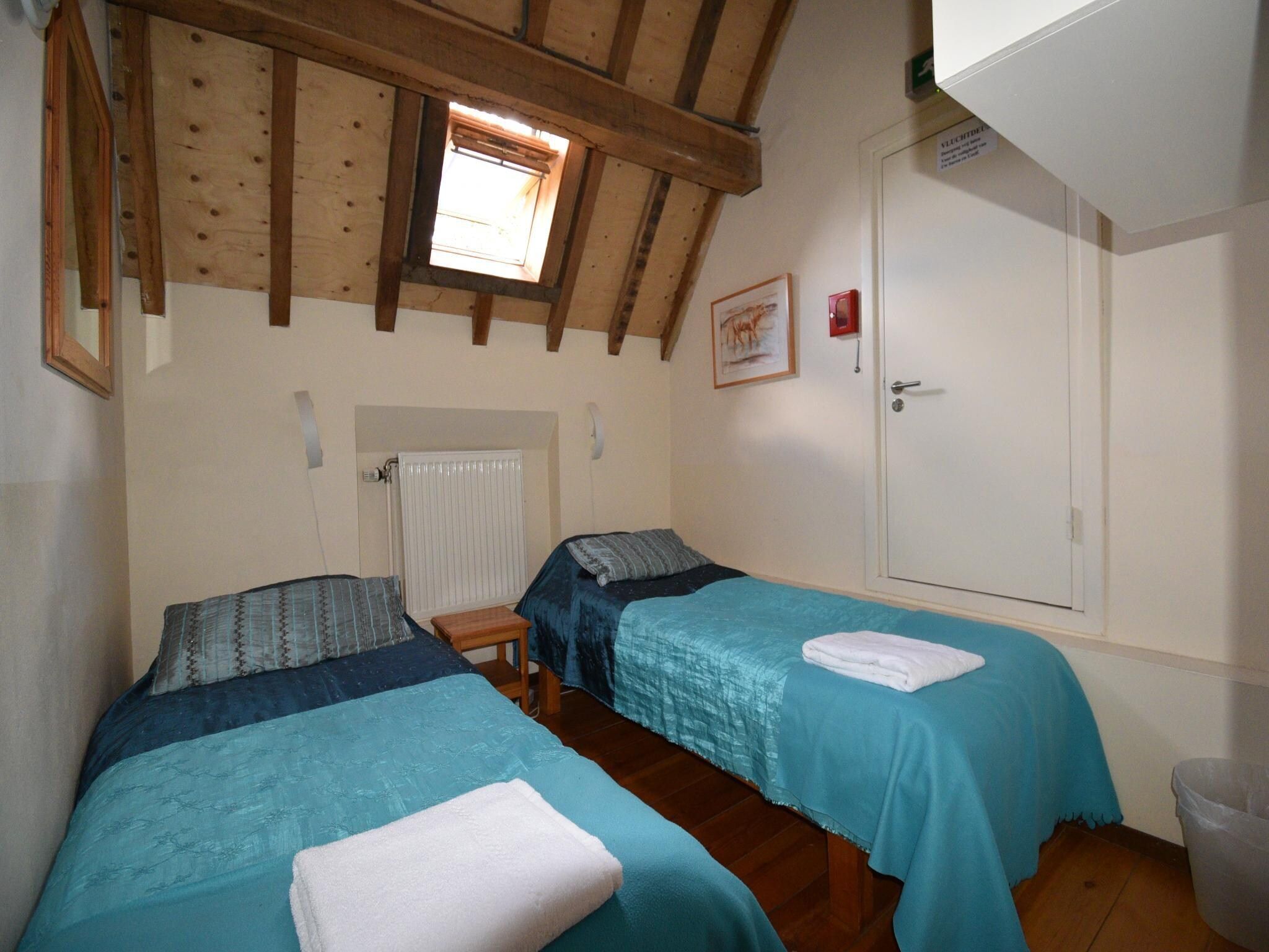 Een slaapkamer van Meschermolen 14 in Mesch-Eijsden