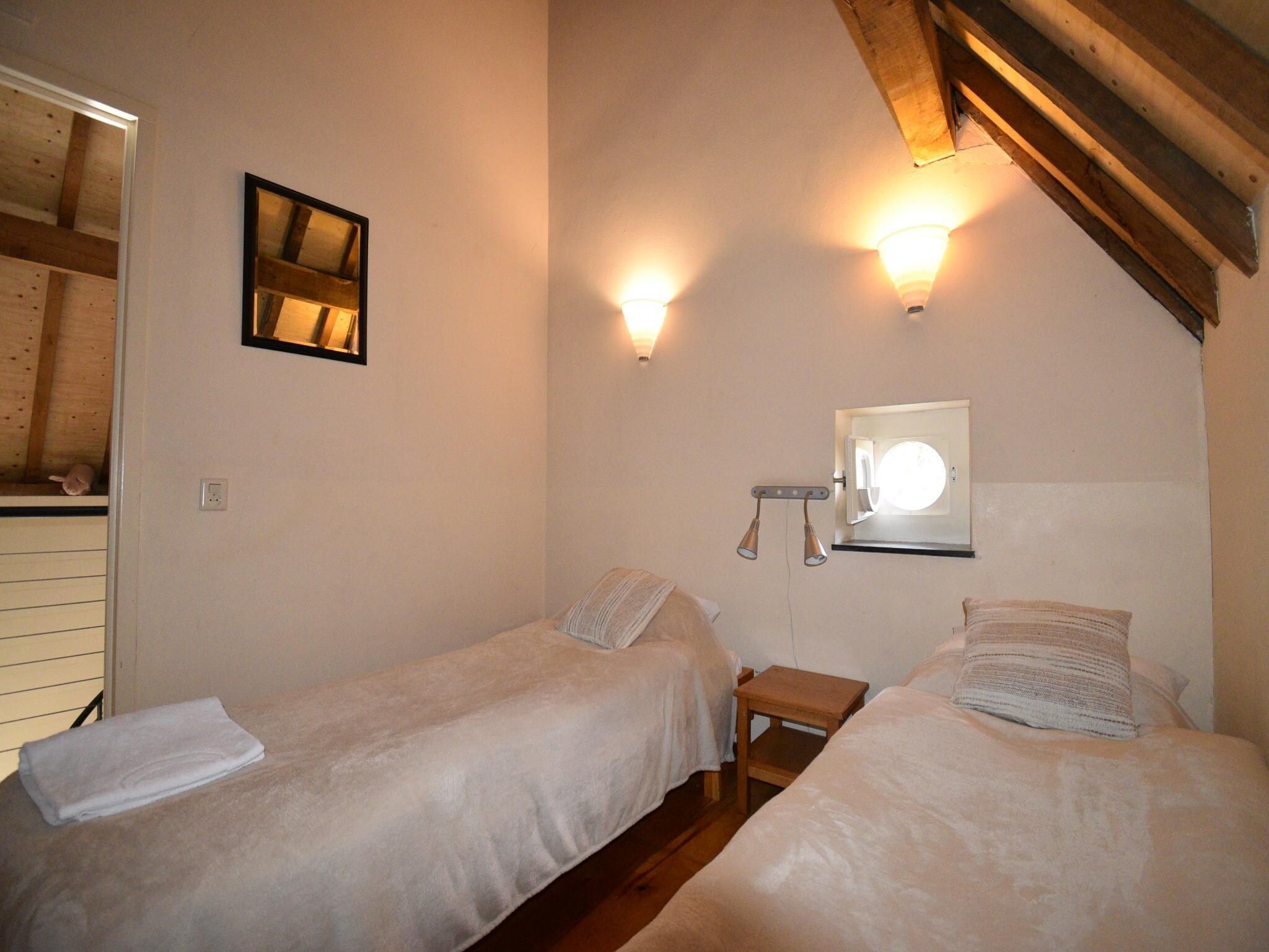 Een slaapkamer van Meschermolen 14 in Mesch-Eijsden