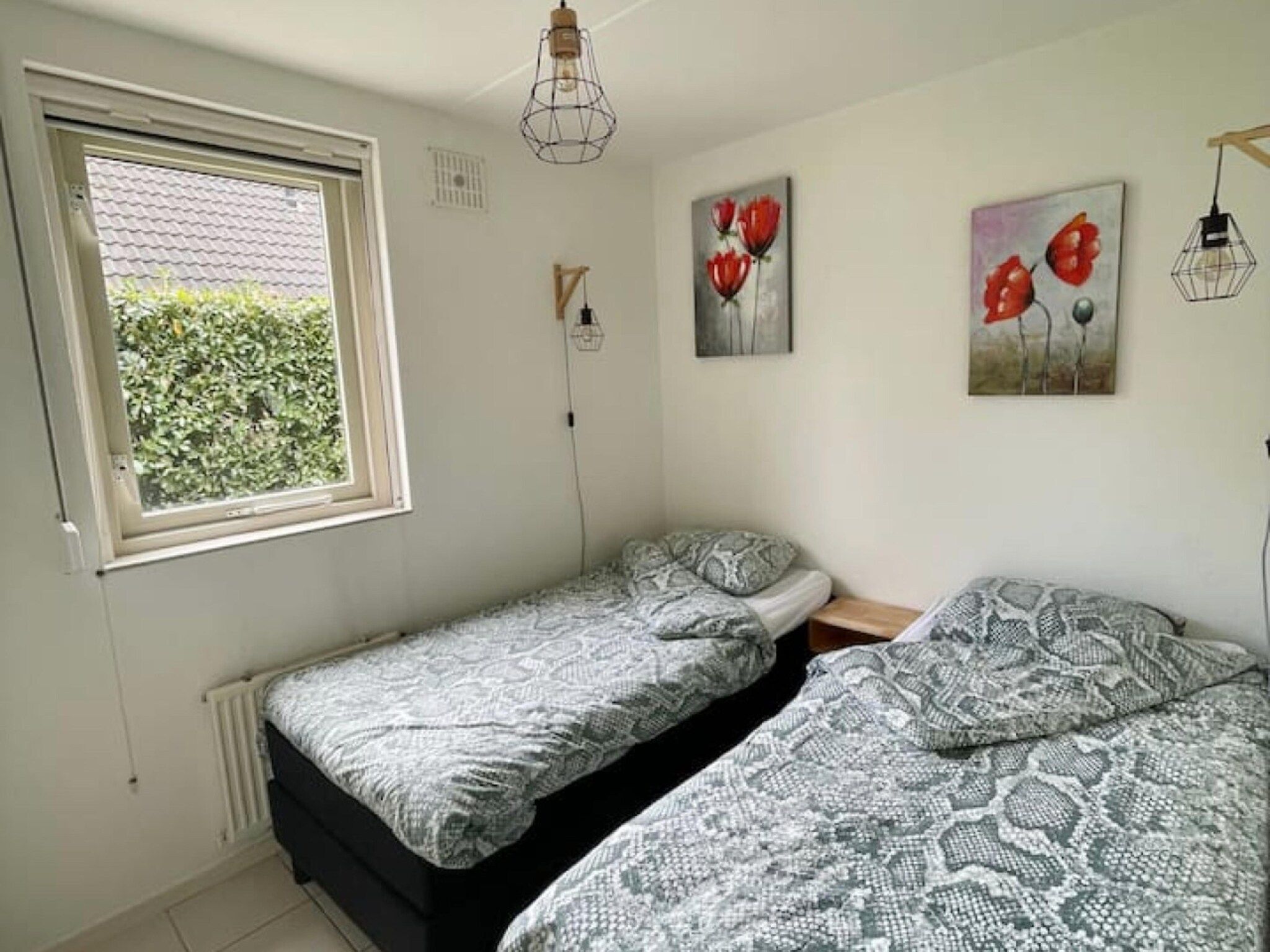 Een slaapkamer van 6 - Persons Forest Bungalow (copy) in Ewijk