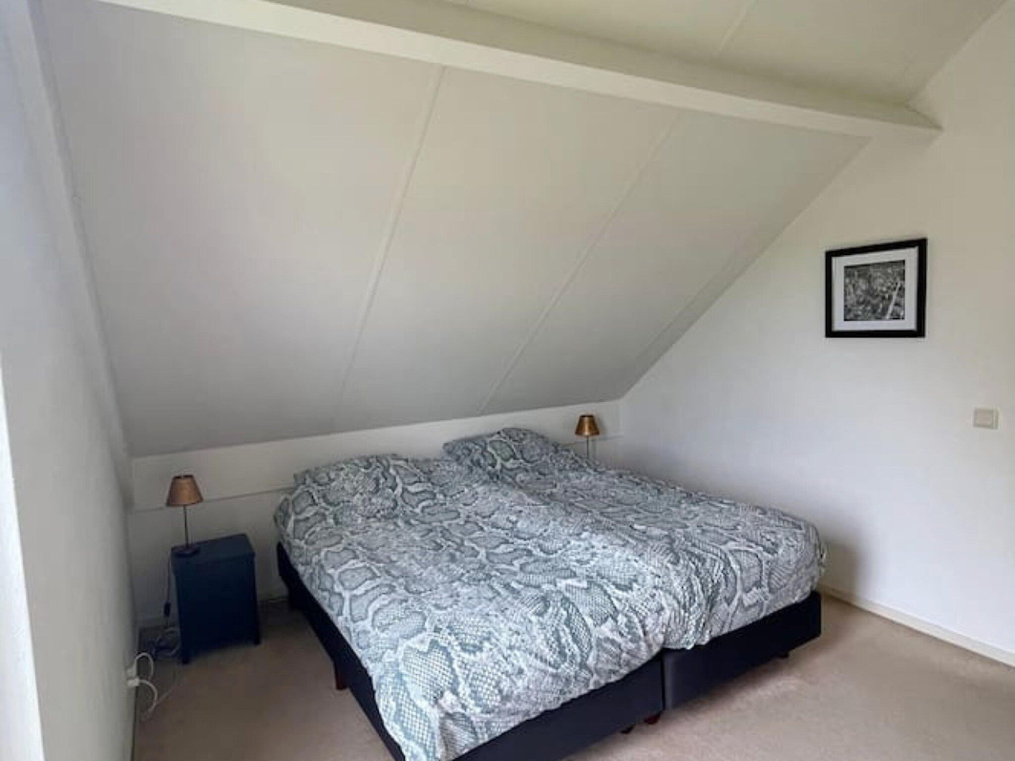 Een slaapkamer van 6 - Persons Forest Bungalow (copy) in Ewijk