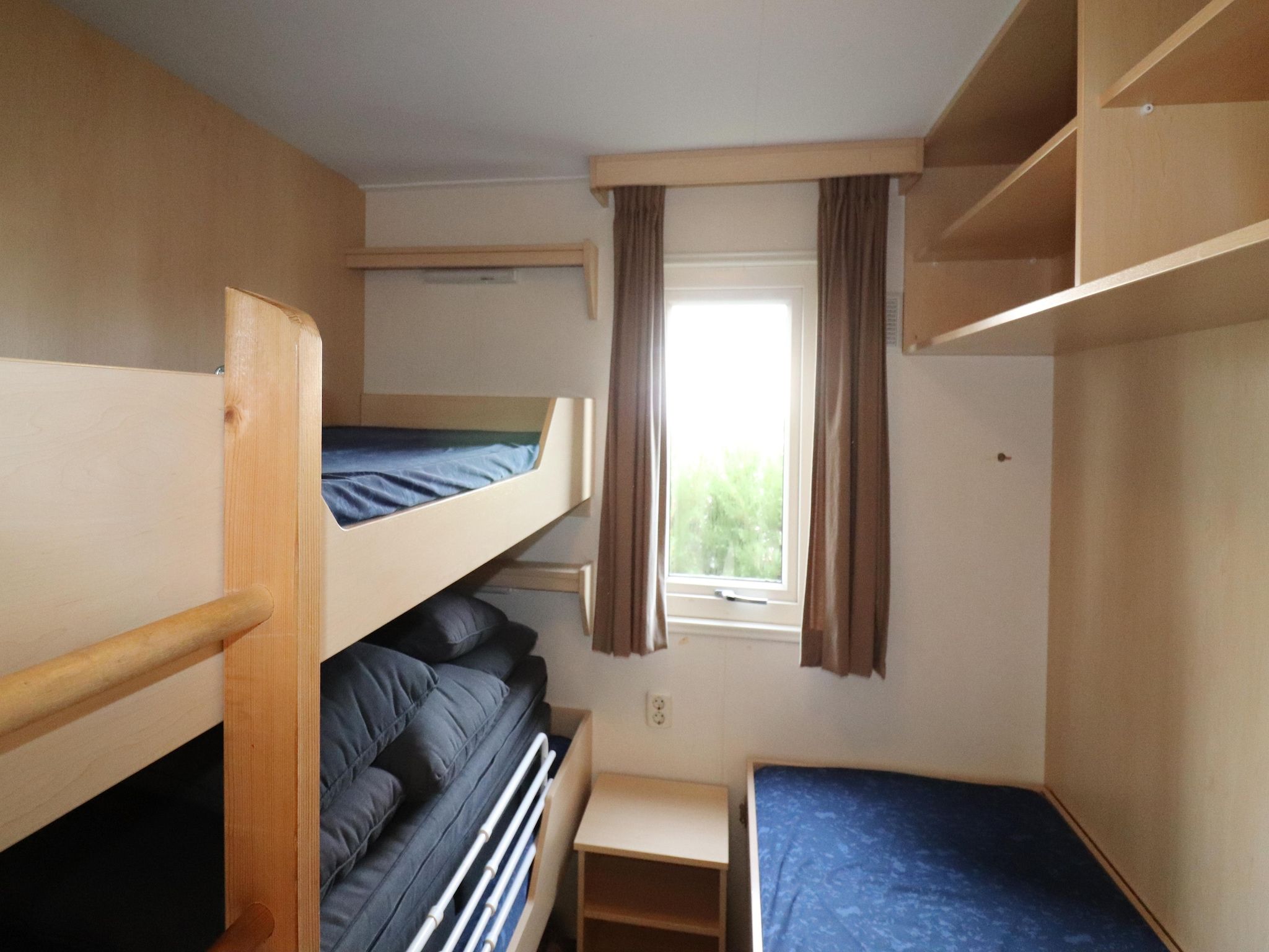 Een slaapkamer van Duinchalet in Hollum