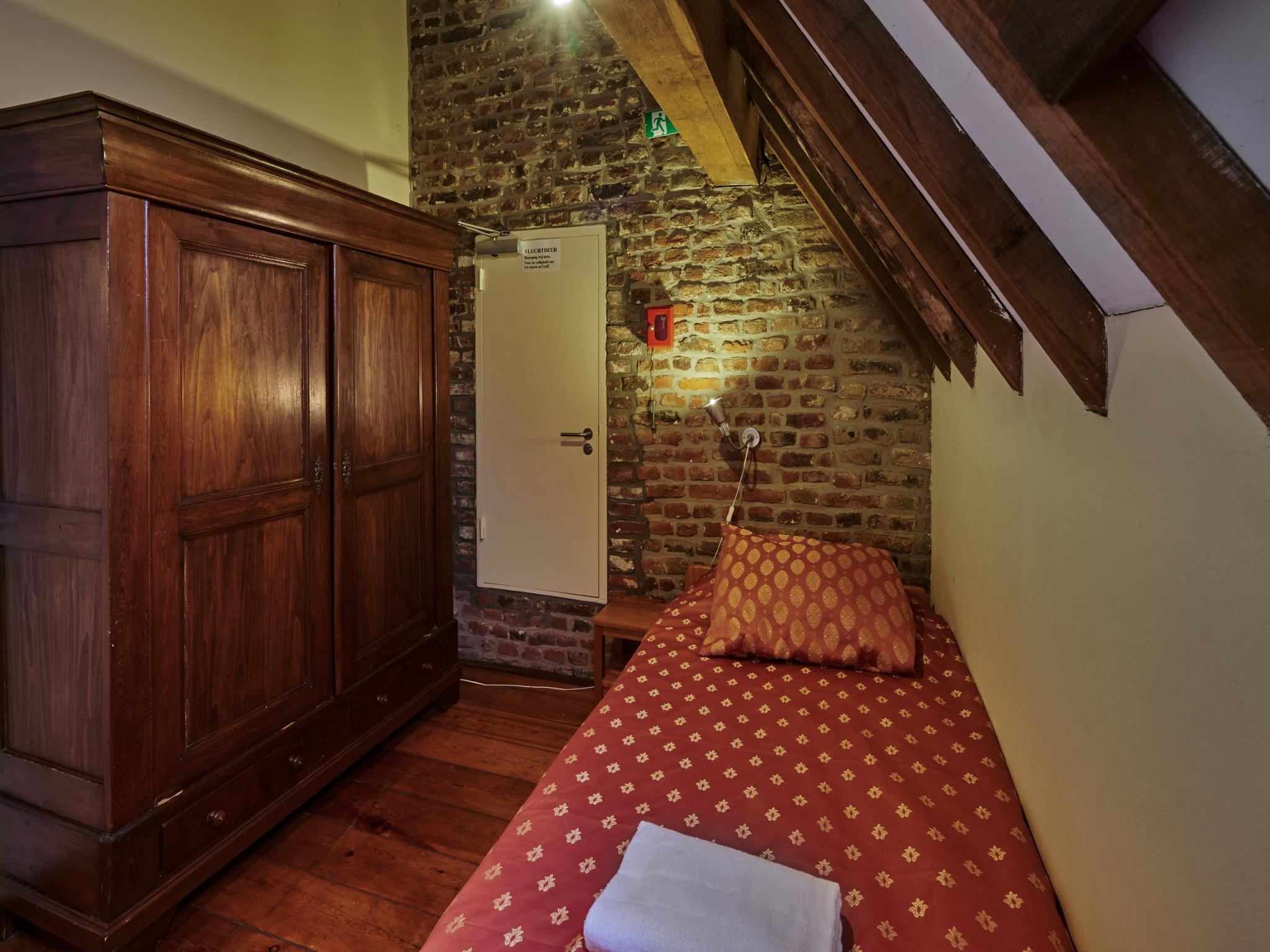 Een slaapkamer van Meschermolen 13 in Mesch-Eijsden