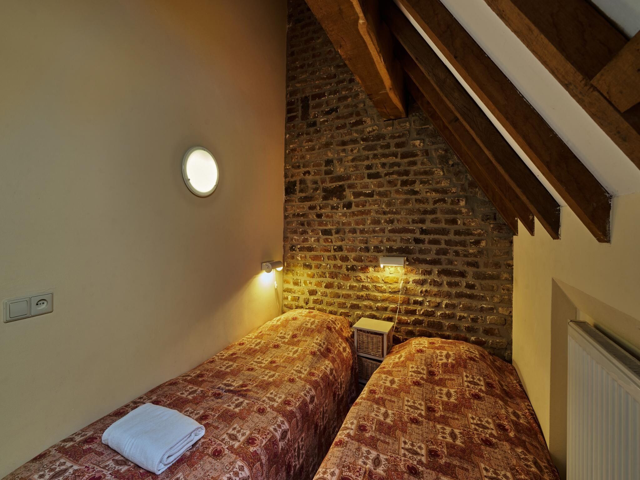 Een slaapkamer van Meschermolen 13 in Mesch-Eijsden