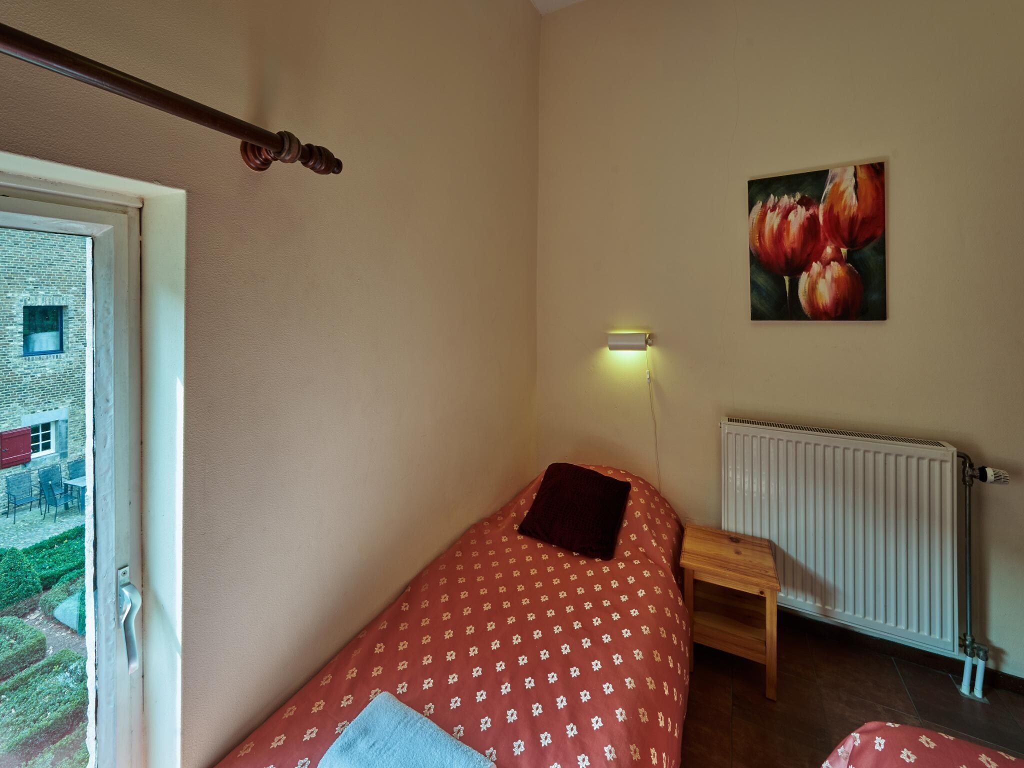 Een slaapkamer van Meschermolen 13 in Mesch-Eijsden