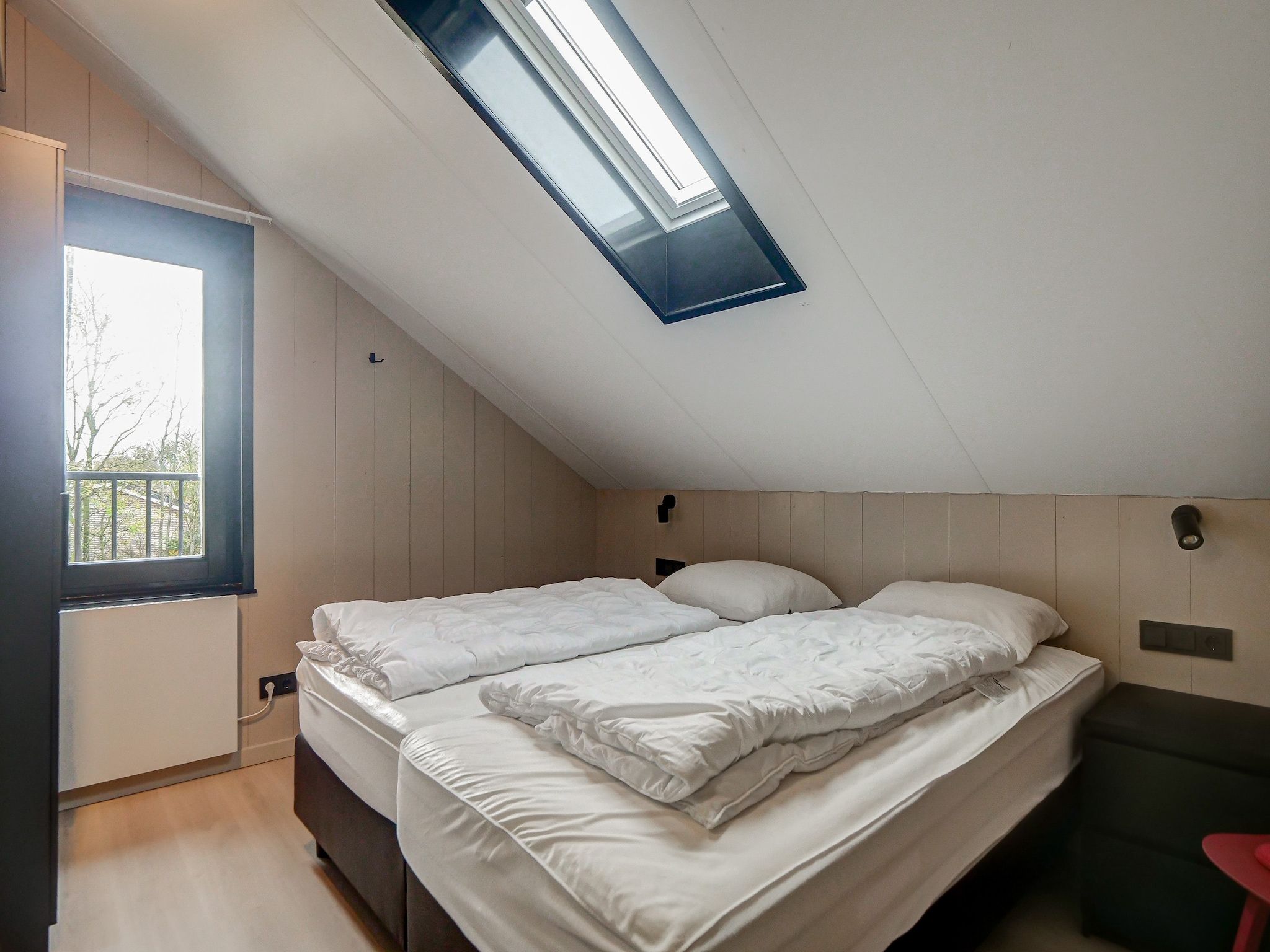 Een slaapkamer van Familiehuis Zee & Zand in Julianadorp