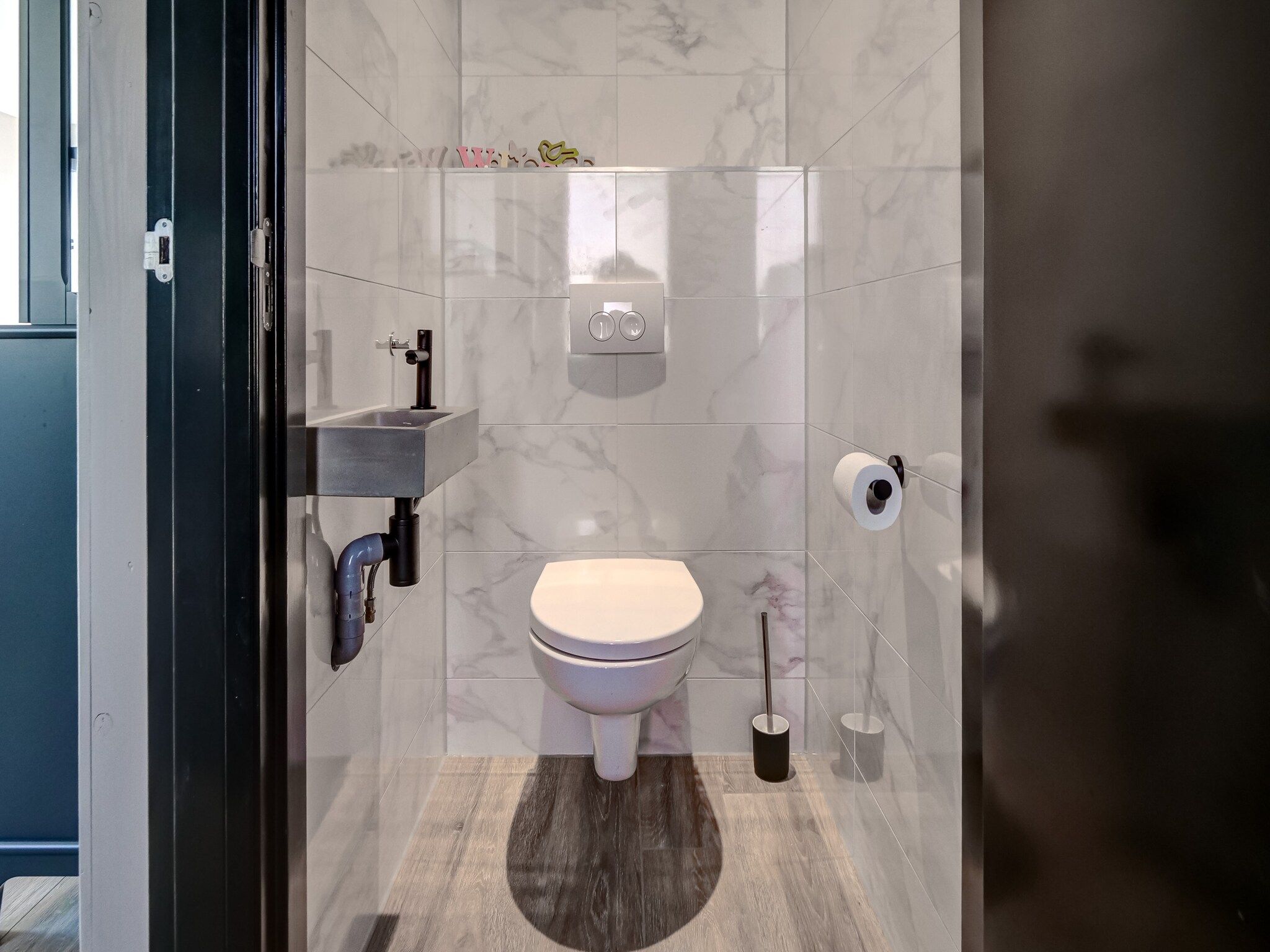 De badkamer van Familiehuis Zee & Zand in Julianadorp