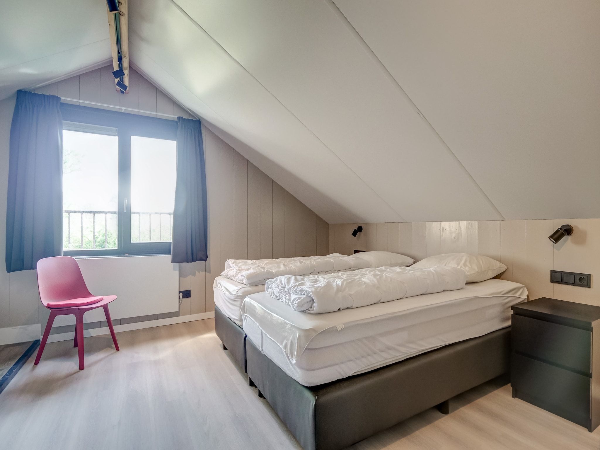 Een slaapkamer van Familiehuis Zee & Zand in Julianadorp