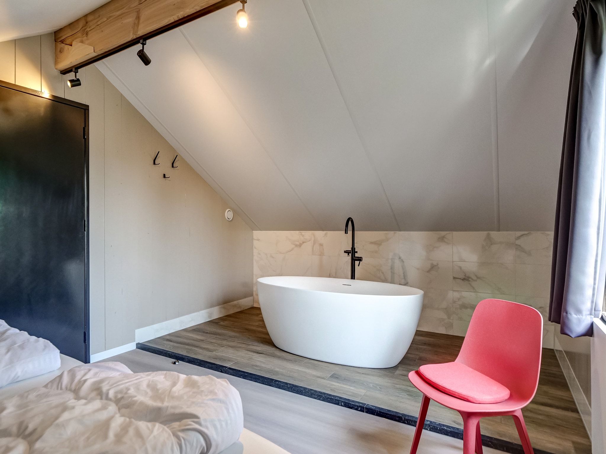 Een slaapkamer van Familiehuis Zee & Zand in Julianadorp