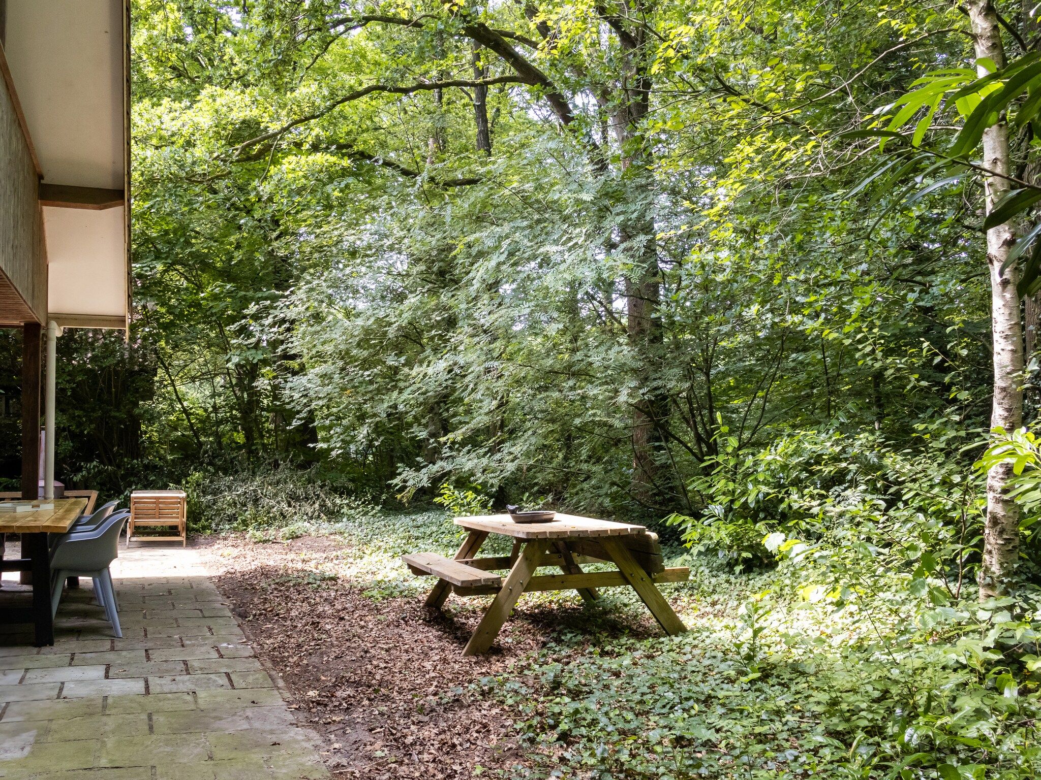 De tuin van Huis in de Bossen in Een