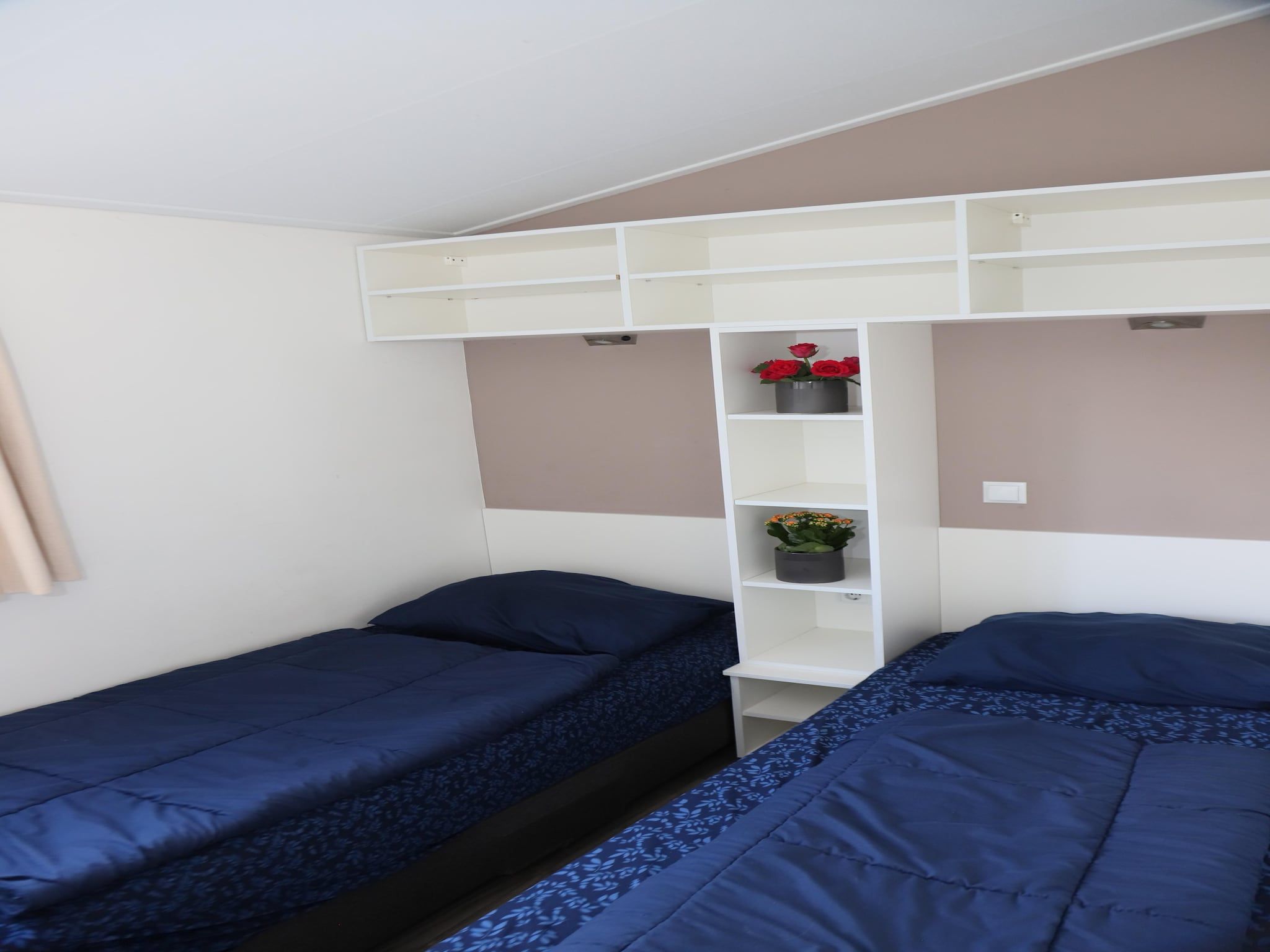 Een slaapkamer van Hackfort kavel 143 in Biddinghuizen