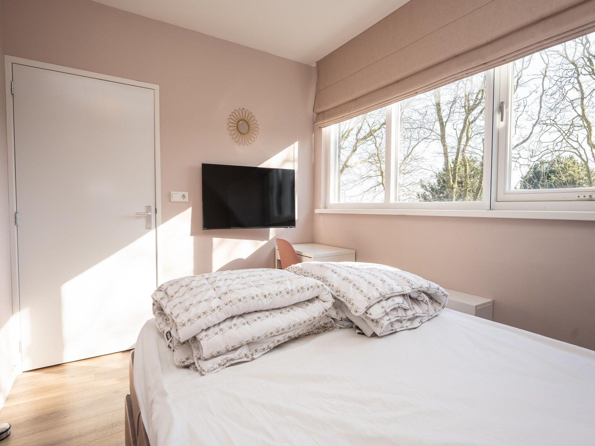 Een slaapkamer van Mienterbos-Heideglop in De Koog