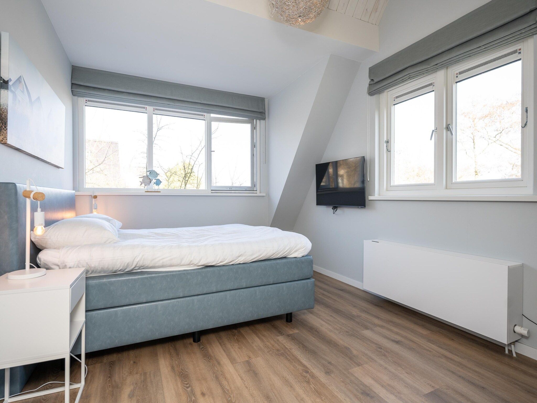 Een slaapkamer van Mienterbos-Duinglop in De Koog