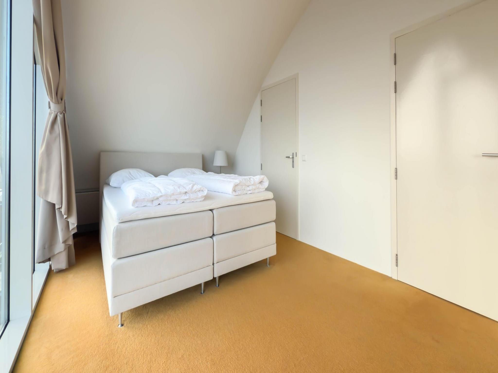 Een slaapkamer van Droomlicht in Egmond aan Zee