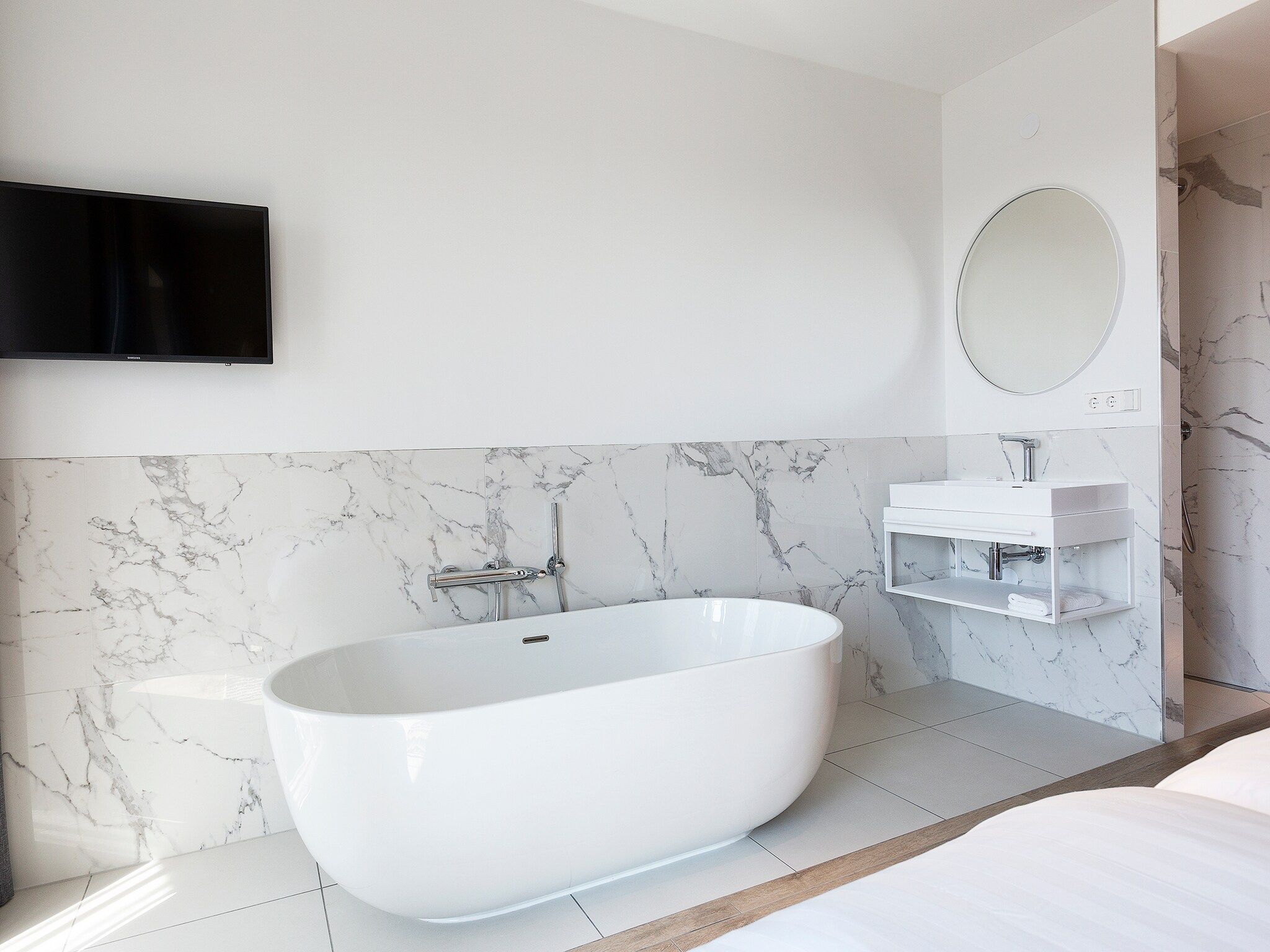 Een slaapkamer van Droomsuites Egmond aan Zee - 8 person penthouse in Egmond aan Zee