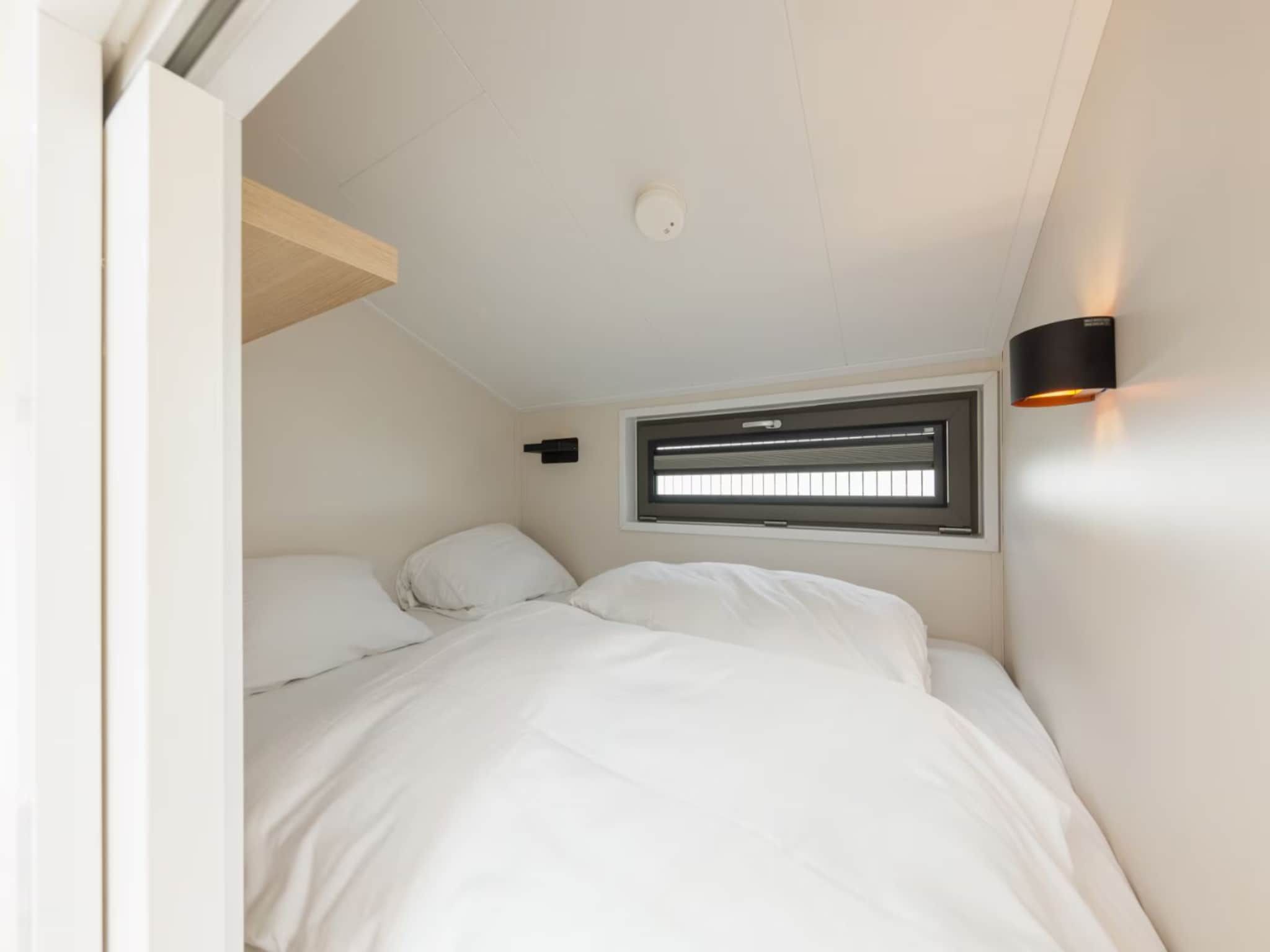 Een slaapkamer van Droomvilla Beach Houses Zandvoort - Partial sea view in Zandvoort