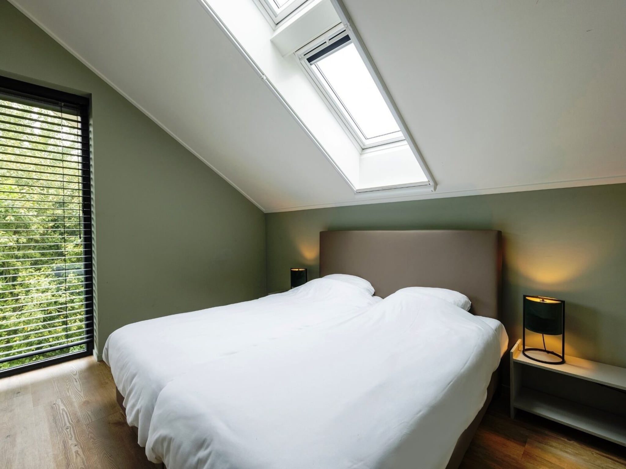 Een slaapkamer van Het Heerlijcke Huis in Aalten