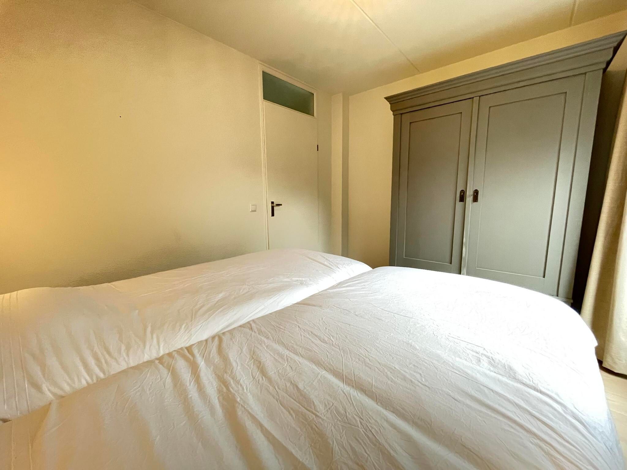 Een slaapkamer van Watervilla de Ijsvogel in Langweer