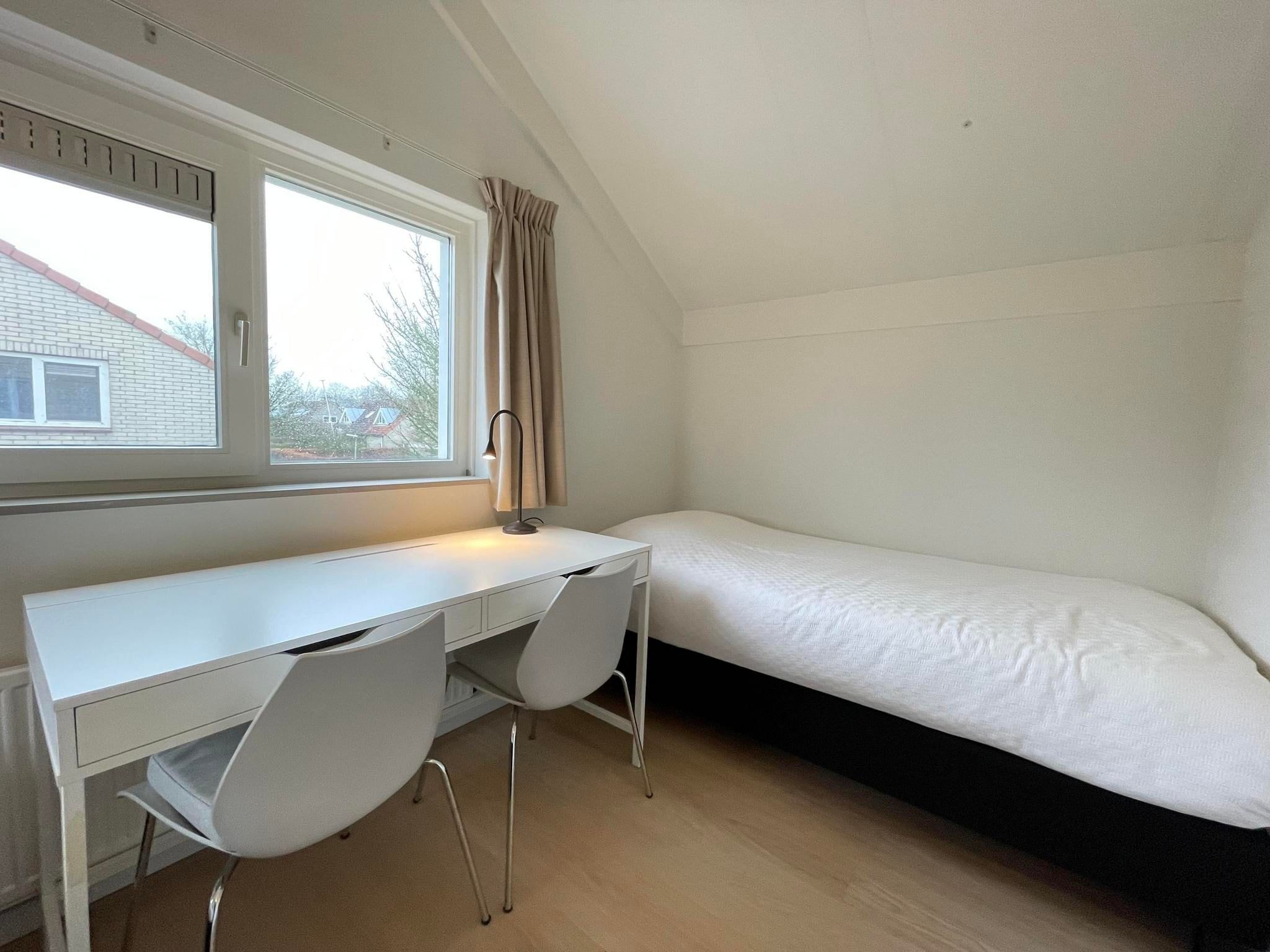 Een slaapkamer van Watervilla de Ijsvogel in Langweer