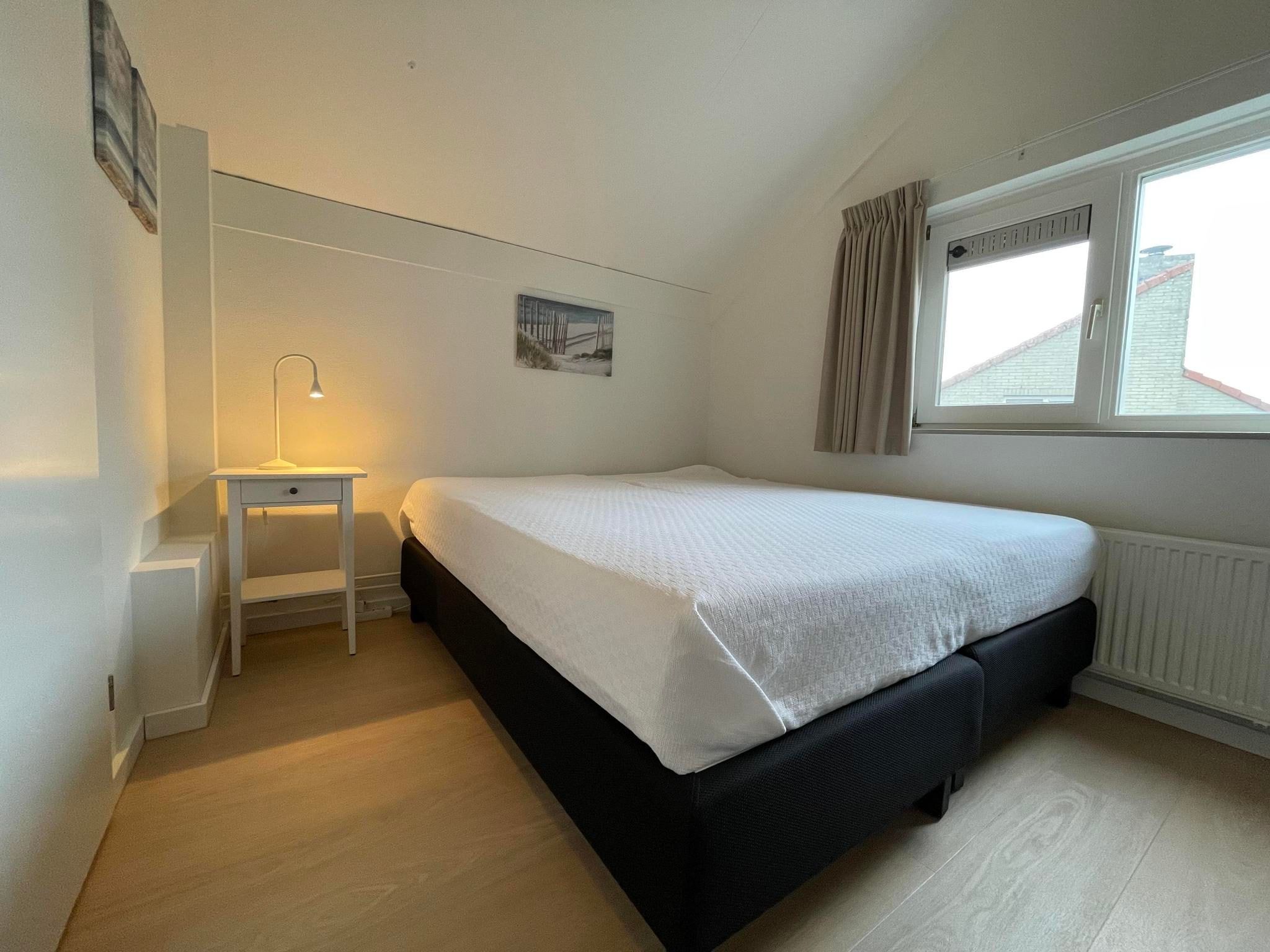 Een slaapkamer van Watervilla de Ijsvogel in Langweer