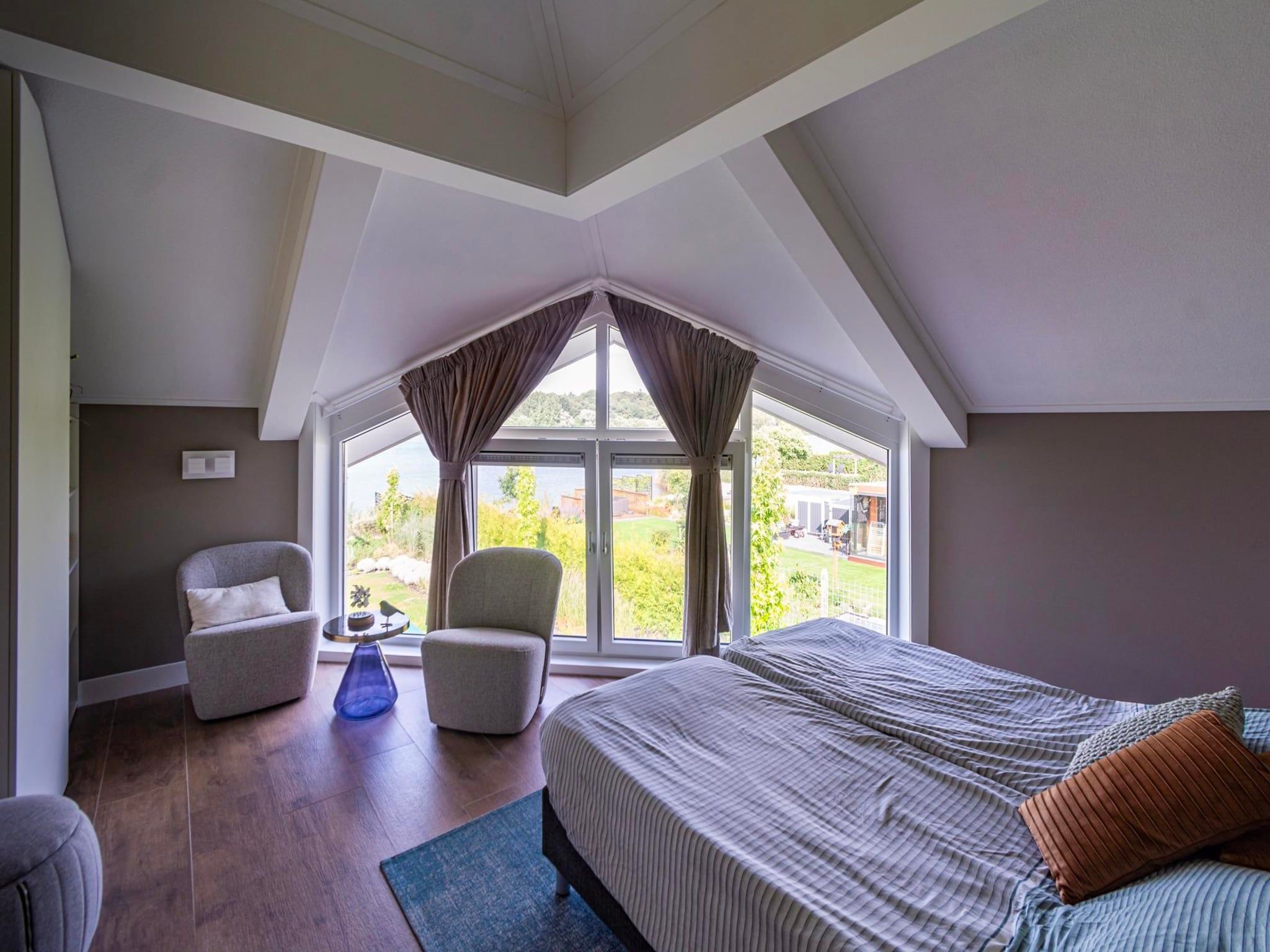 Een slaapkamer van Watervilla Plas van Francke in Sibculo