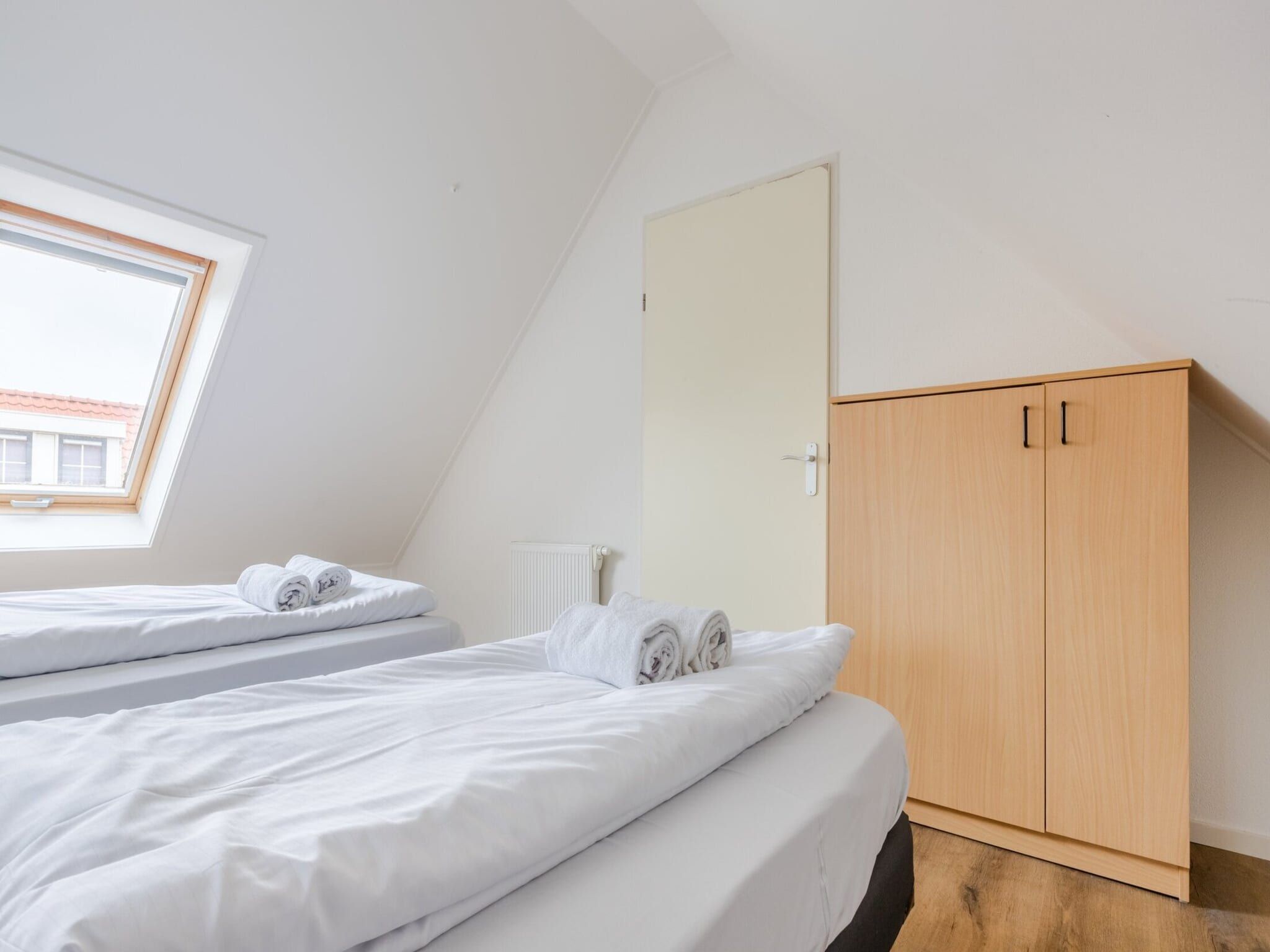 Een slaapkamer van Kustpark Texel 6 in De Koog