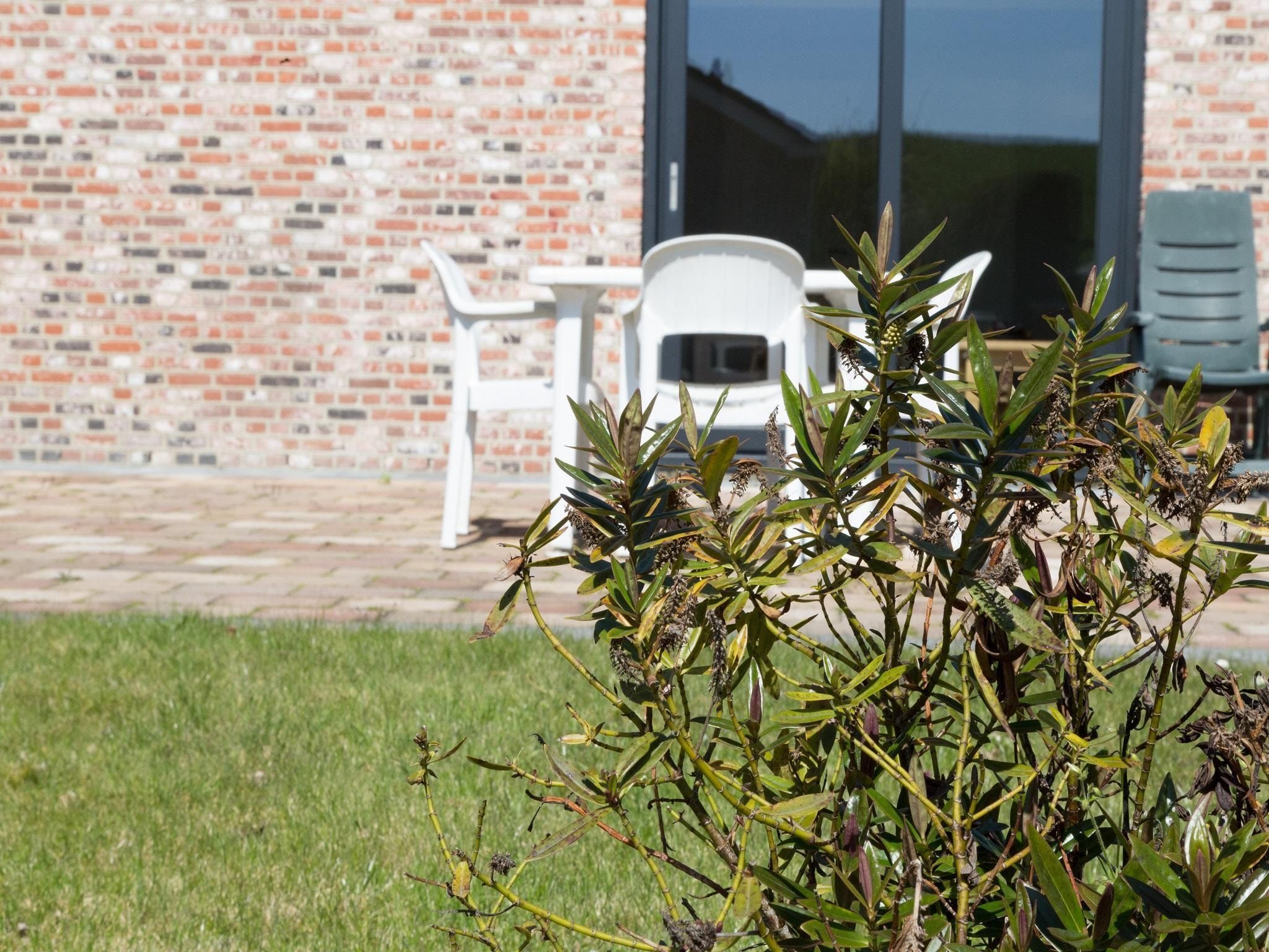De tuin van 2 fijne Zeeuwse huisjes in Baarland