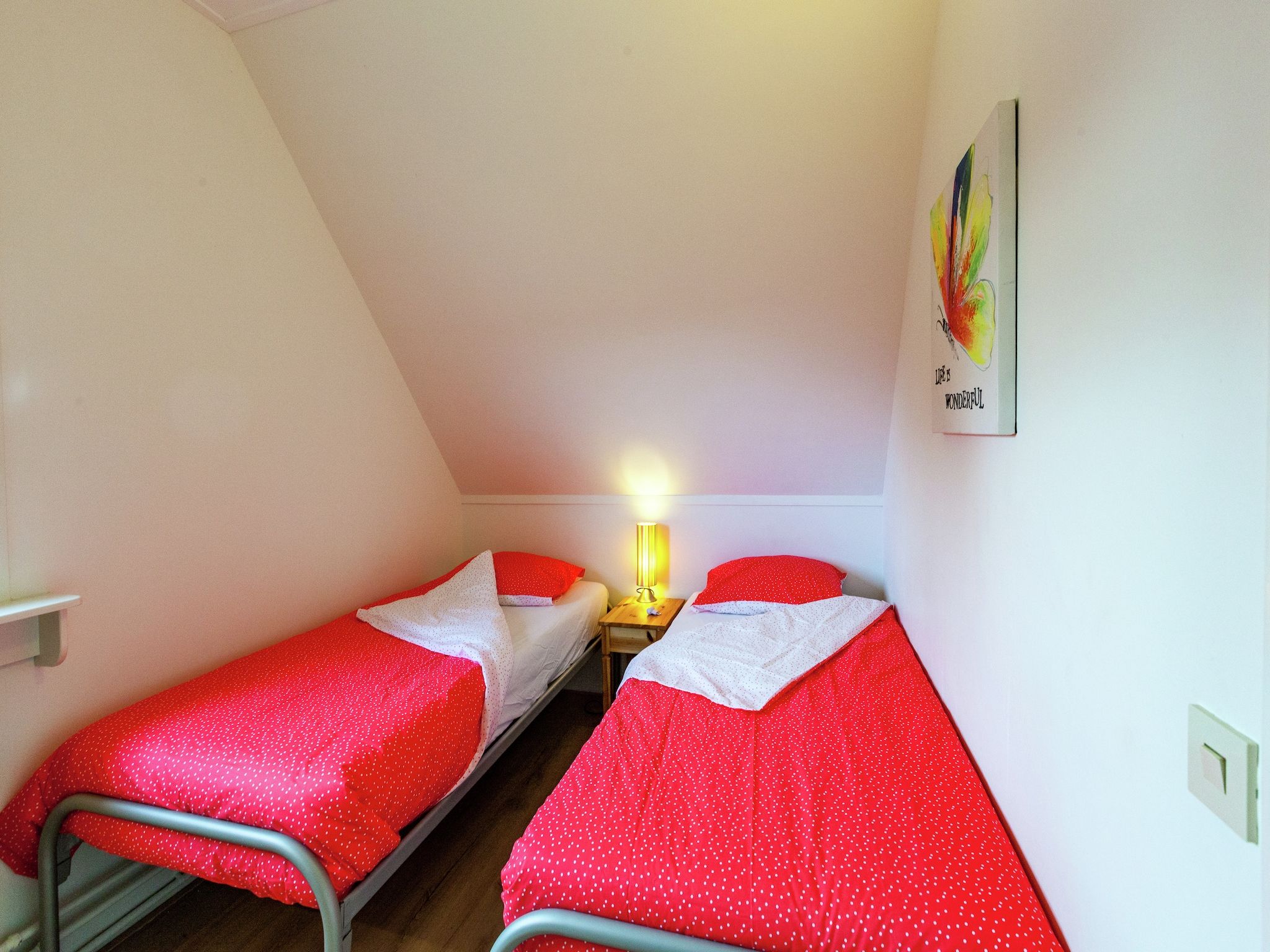 Een slaapkamer van De Scholekster in Oostmahorn