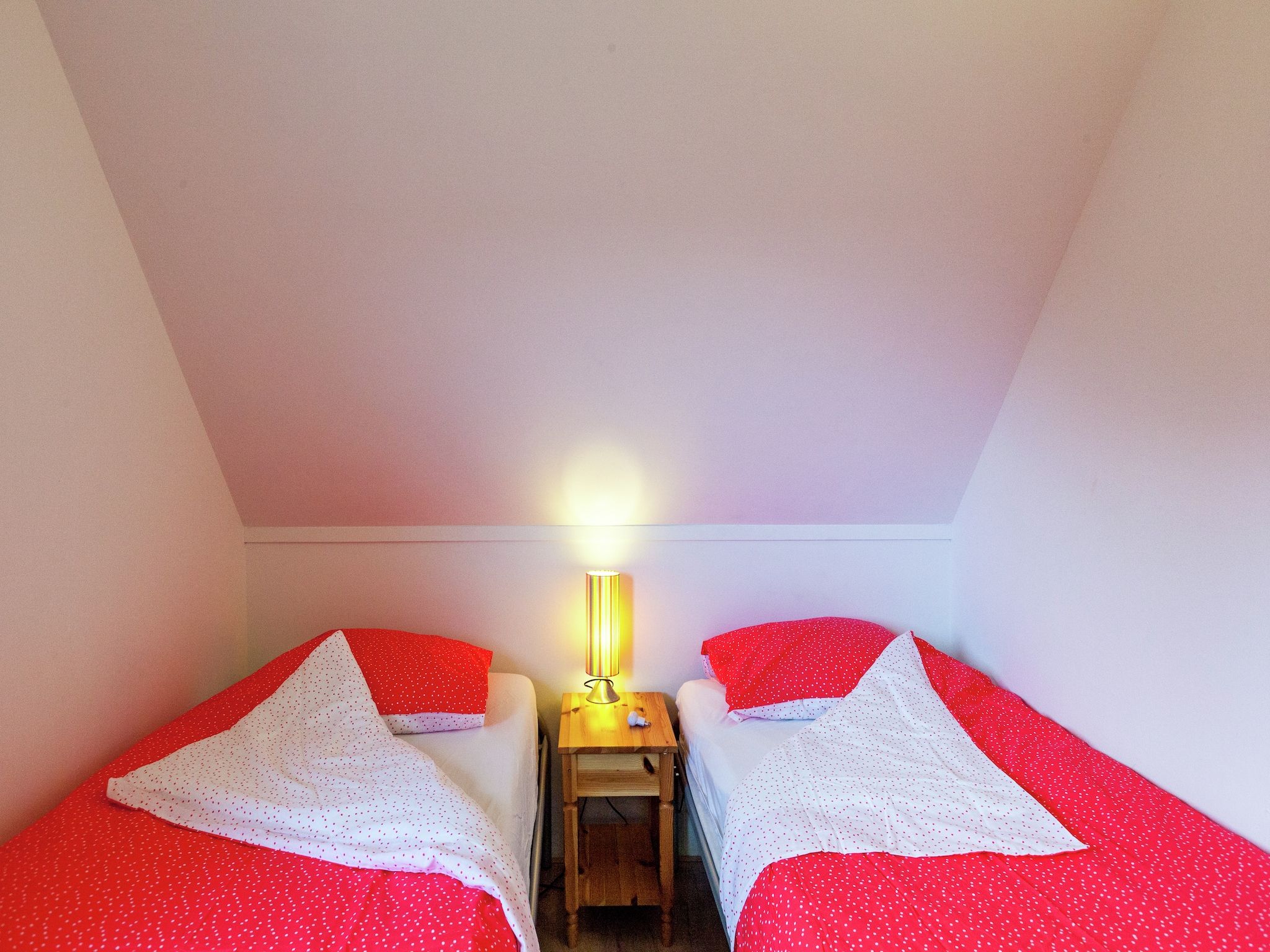 Een slaapkamer van De Scholekster in Oostmahorn