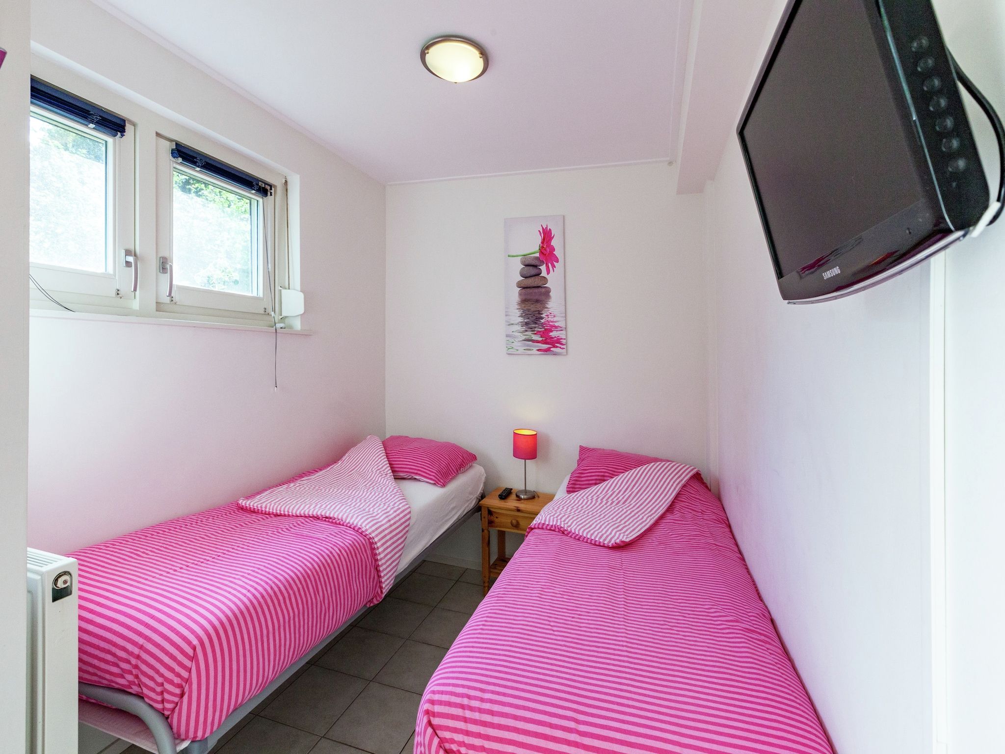 Een slaapkamer van De Scholekster in Oostmahorn