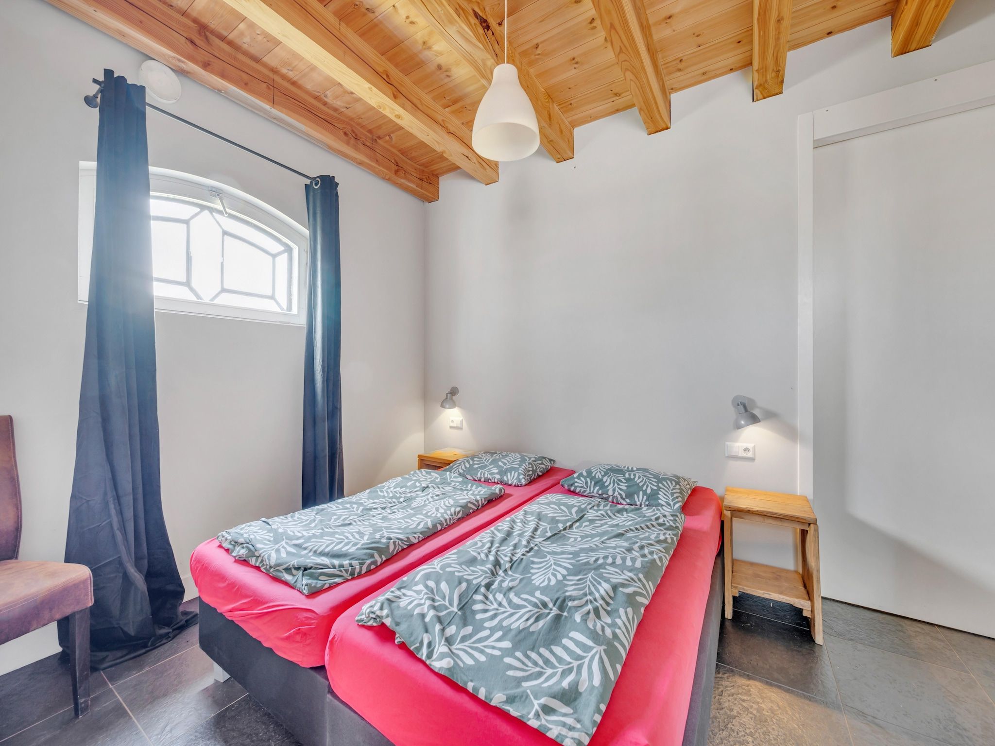 Een slaapkamer van De Kleine Stal in Snelrewaard