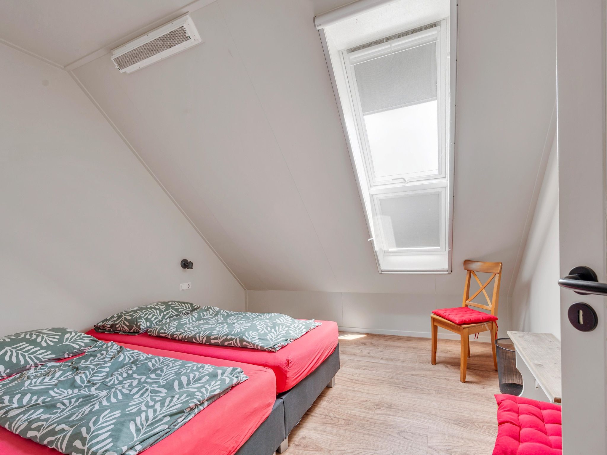 Een slaapkamer van De Kleine Stal in Snelrewaard