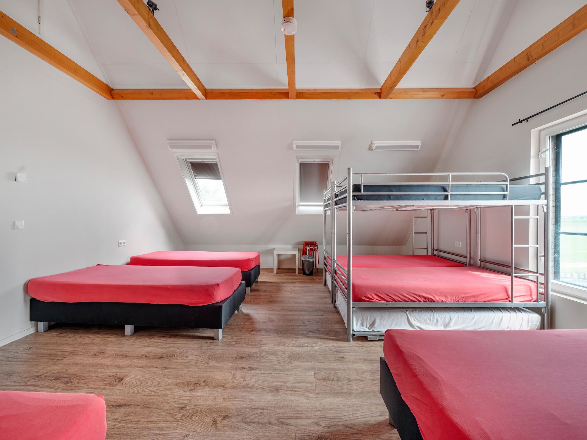 Een slaapkamer van De Kleine Stal in Snelrewaard