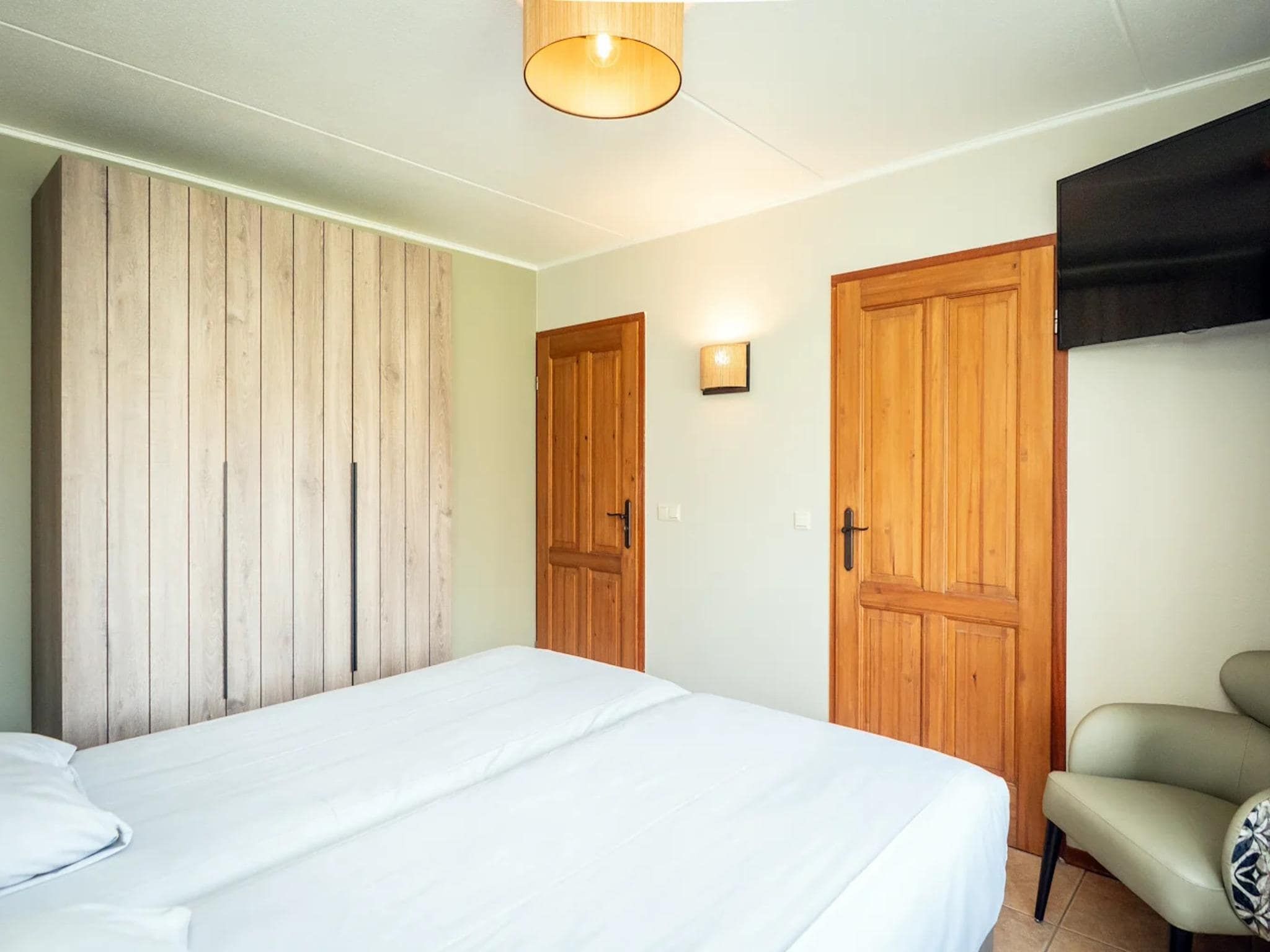 Een slaapkamer van Villas 202 and 208 in De Koog