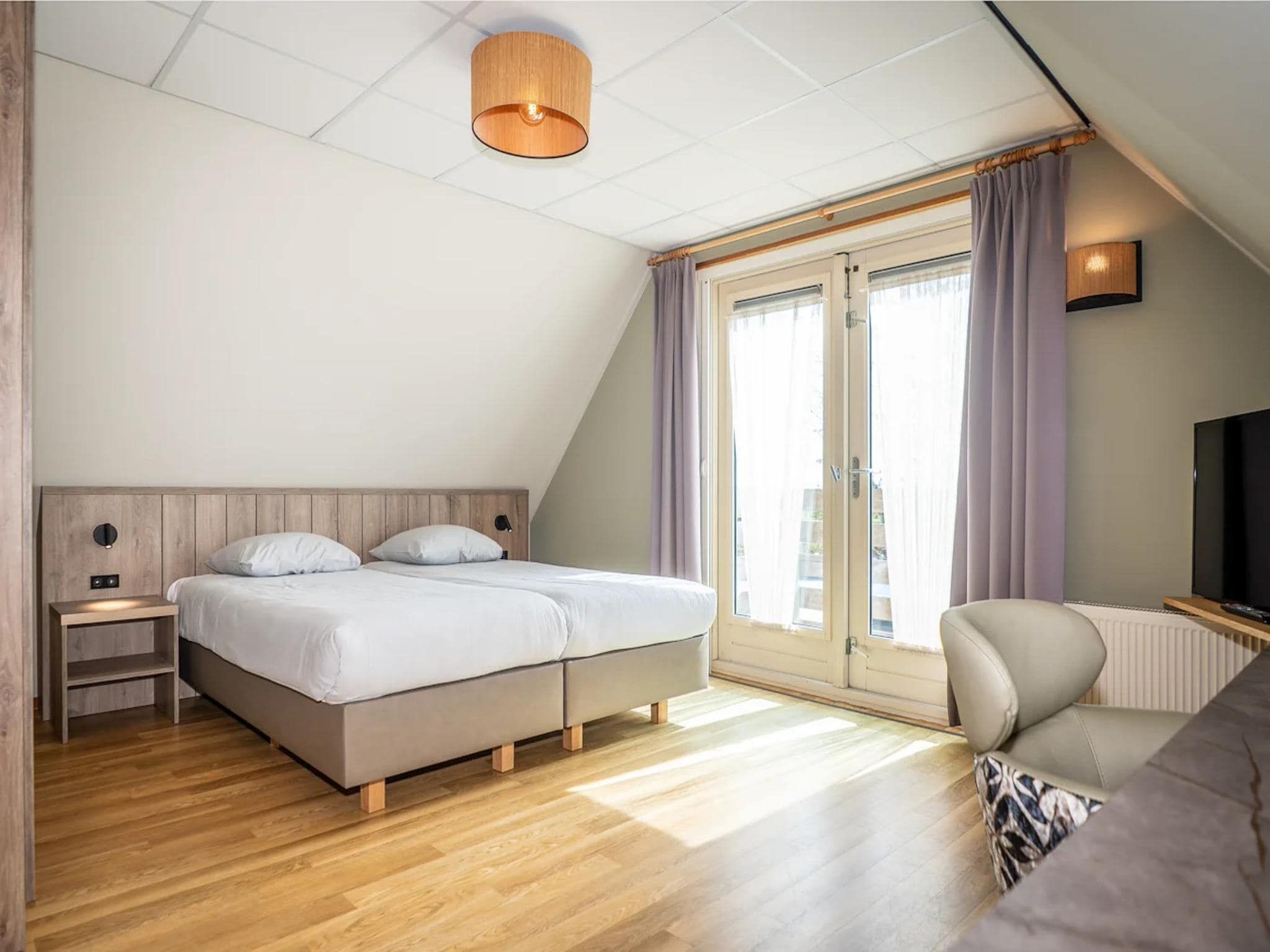 Een slaapkamer van Villas 202 and 208 in De Koog