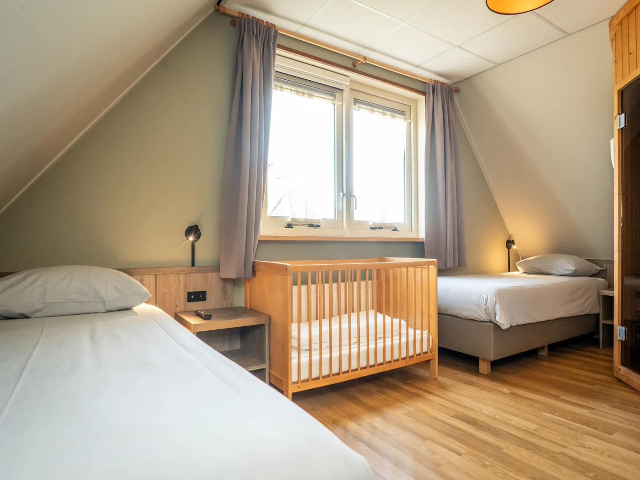Een slaapkamer van Villas 202 and 208 in De Koog