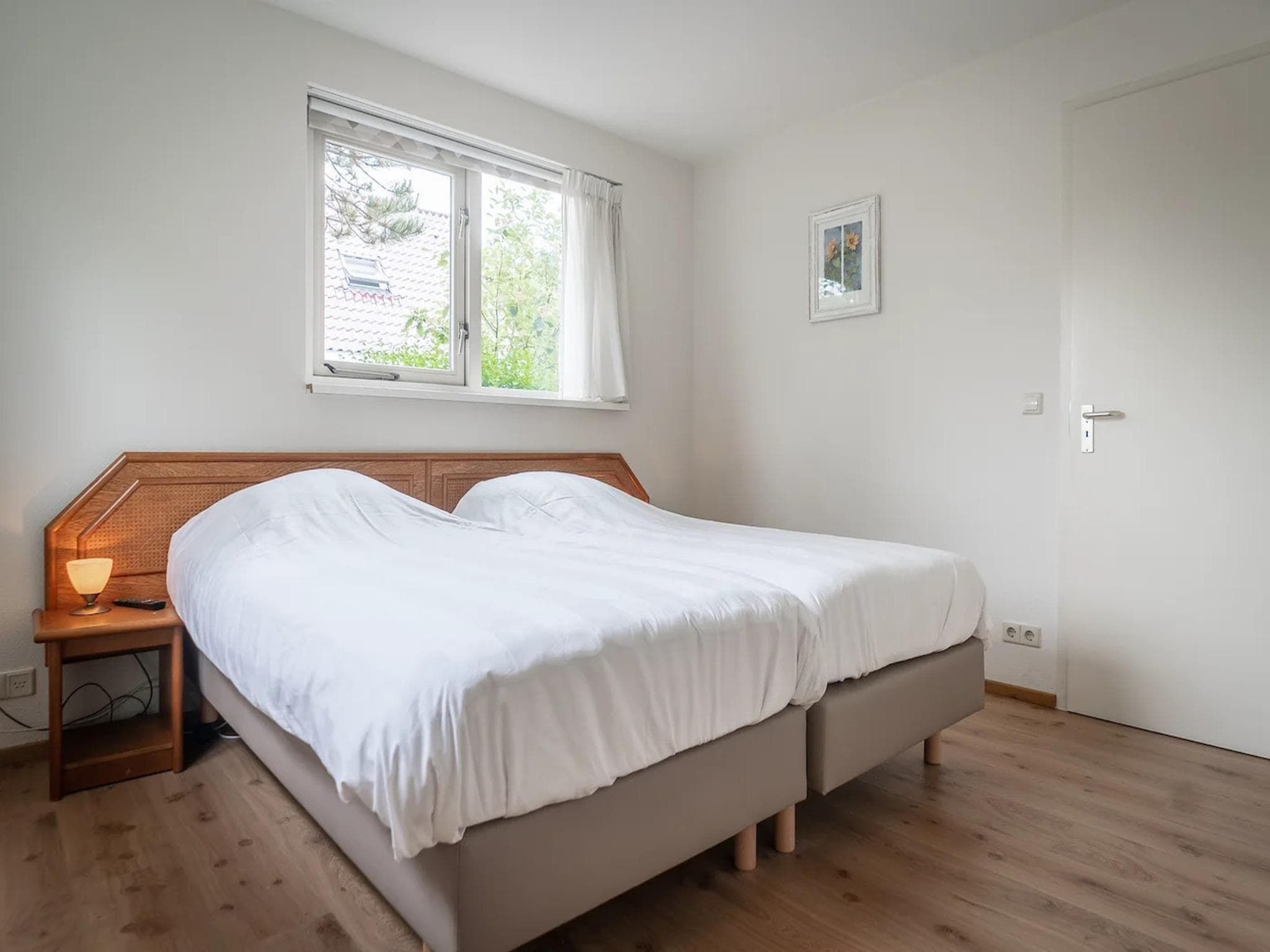 Een slaapkamer van 6-person villa in a Texel villa park in De Koog
