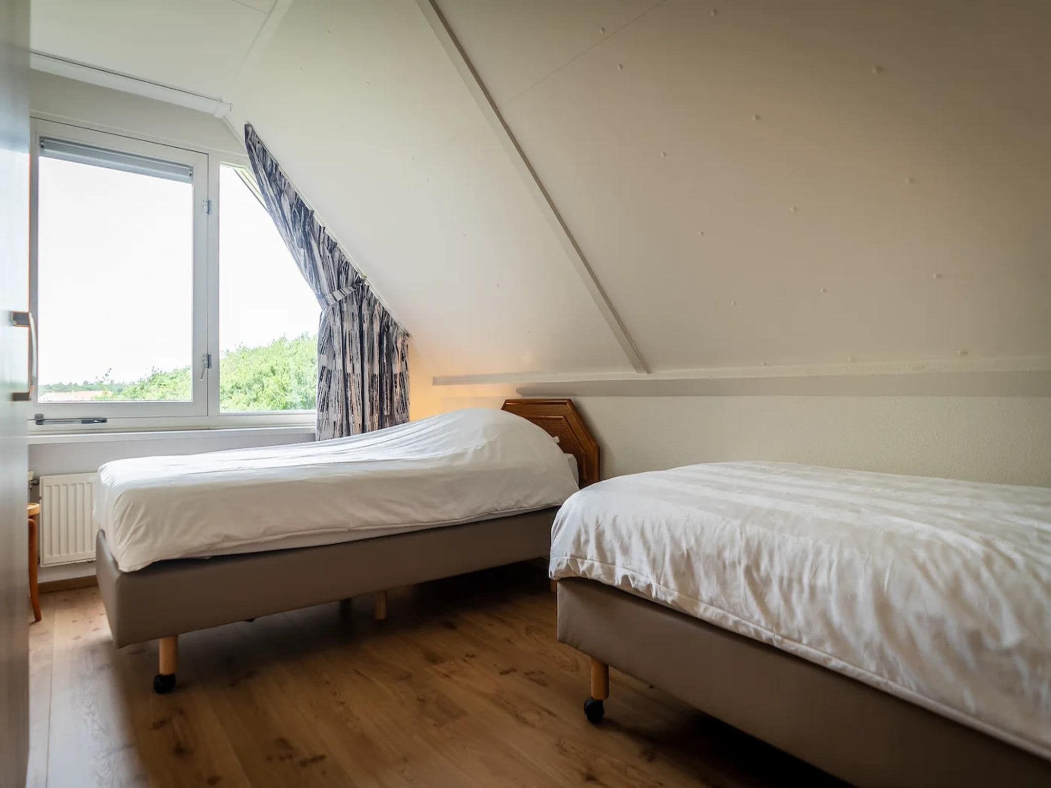 Een slaapkamer van 6-person villa in a Texel villa park in De Koog