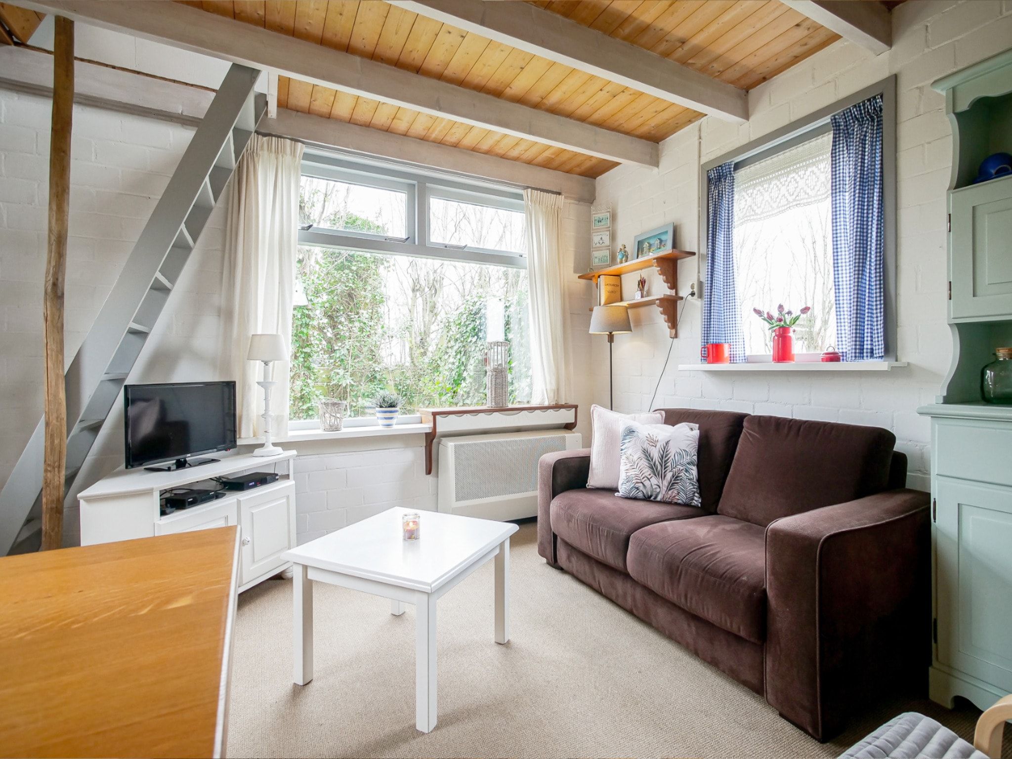 De woonkamer van Vakantiehuisje Vloed in Callantsoog