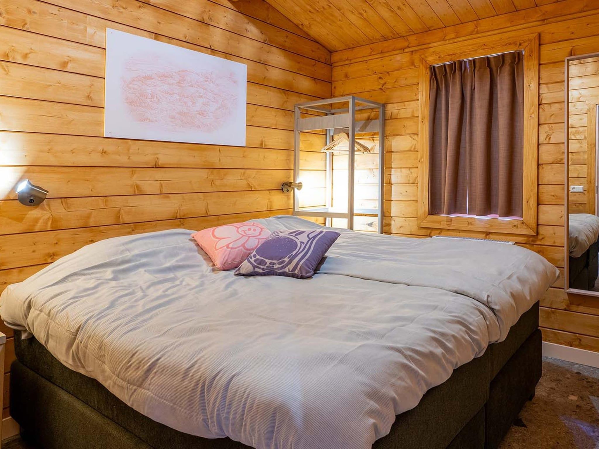 Een slaapkamer van Woezel & Pip Lodge 4p in Hoogerheide