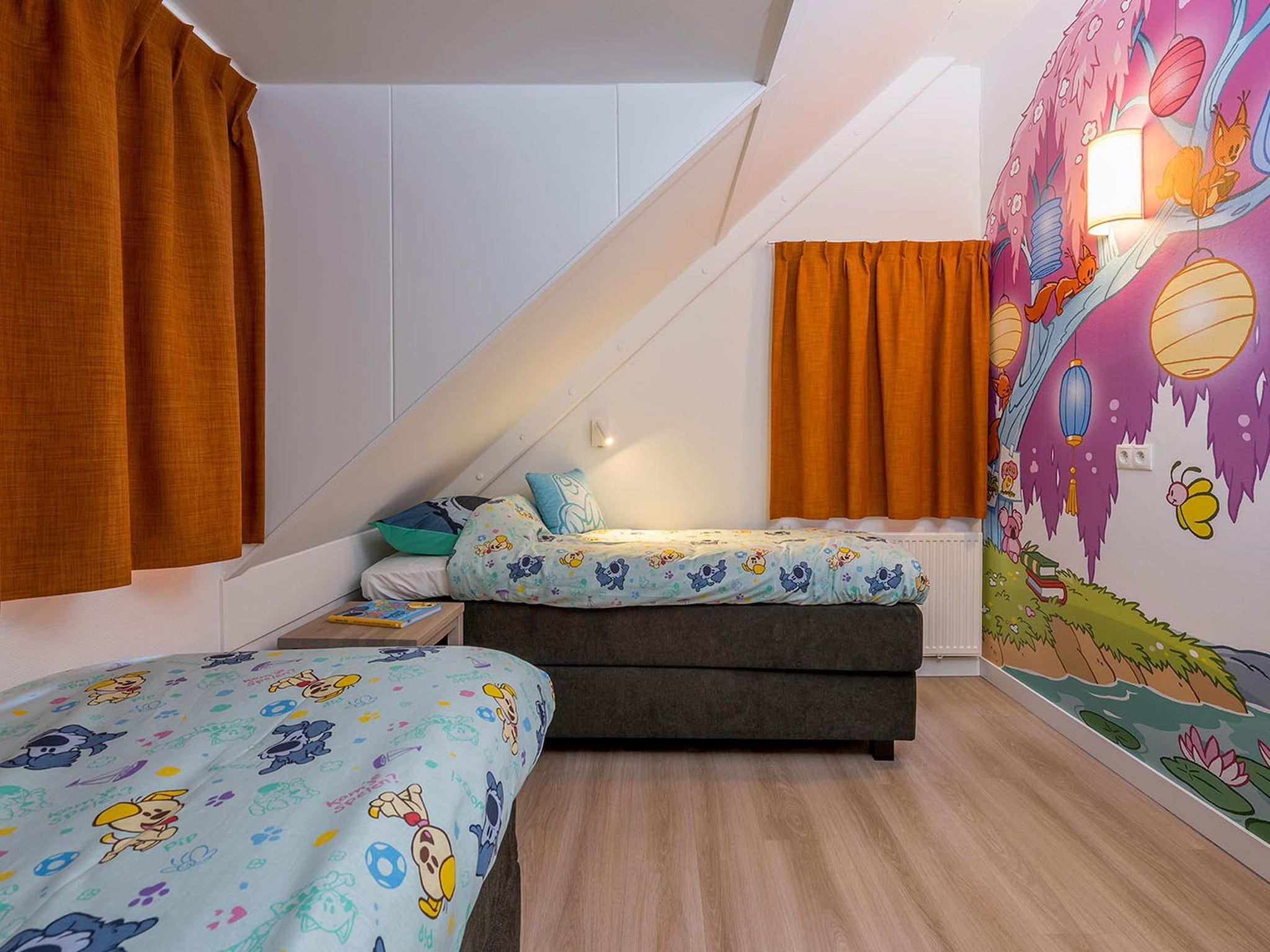 Een slaapkamer van Woezel & Pip Villa - Mindervaliden 8p in Hoogerheide