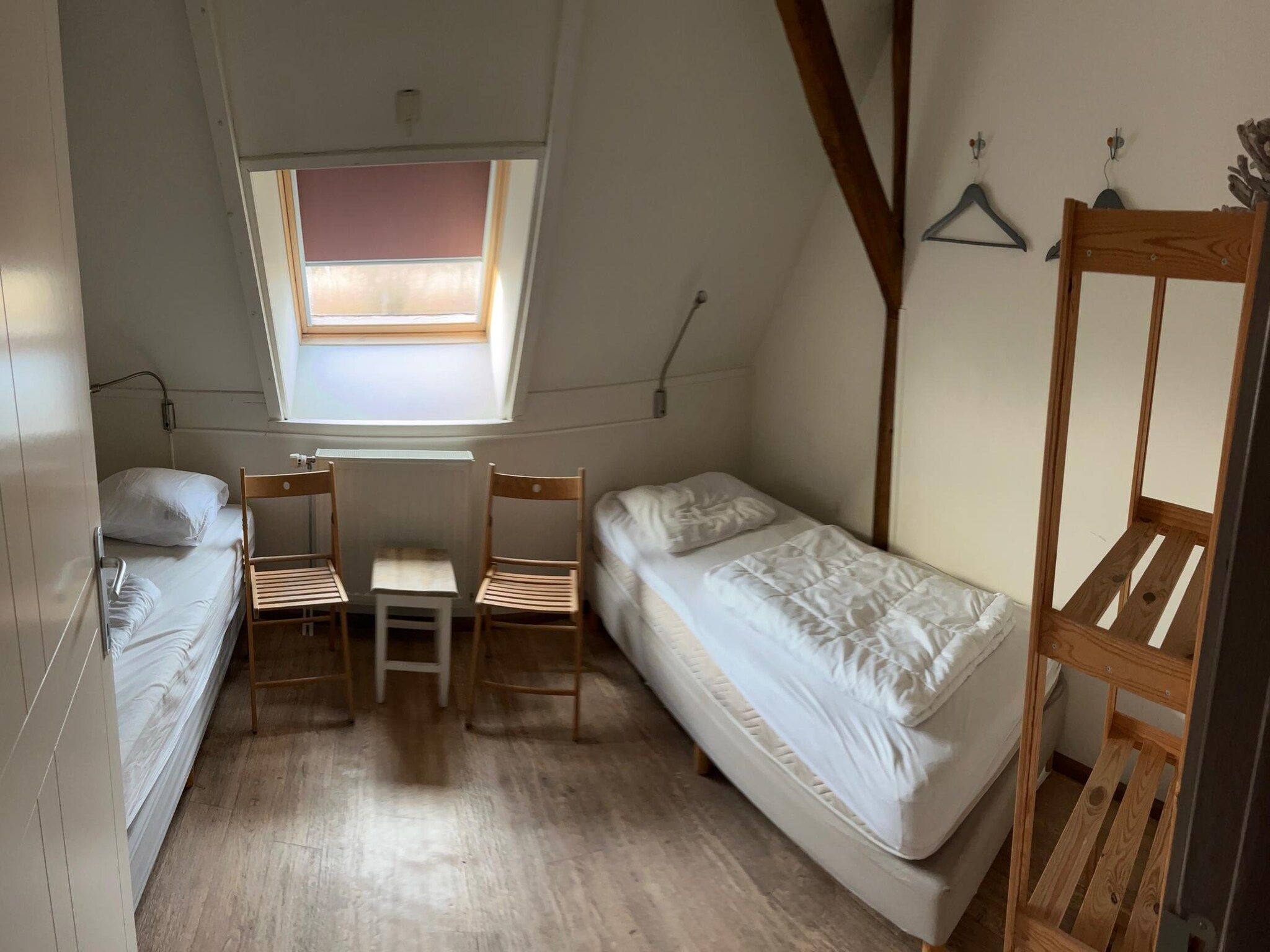 Een slaapkamer van Appartement De Hooizolder in Eede