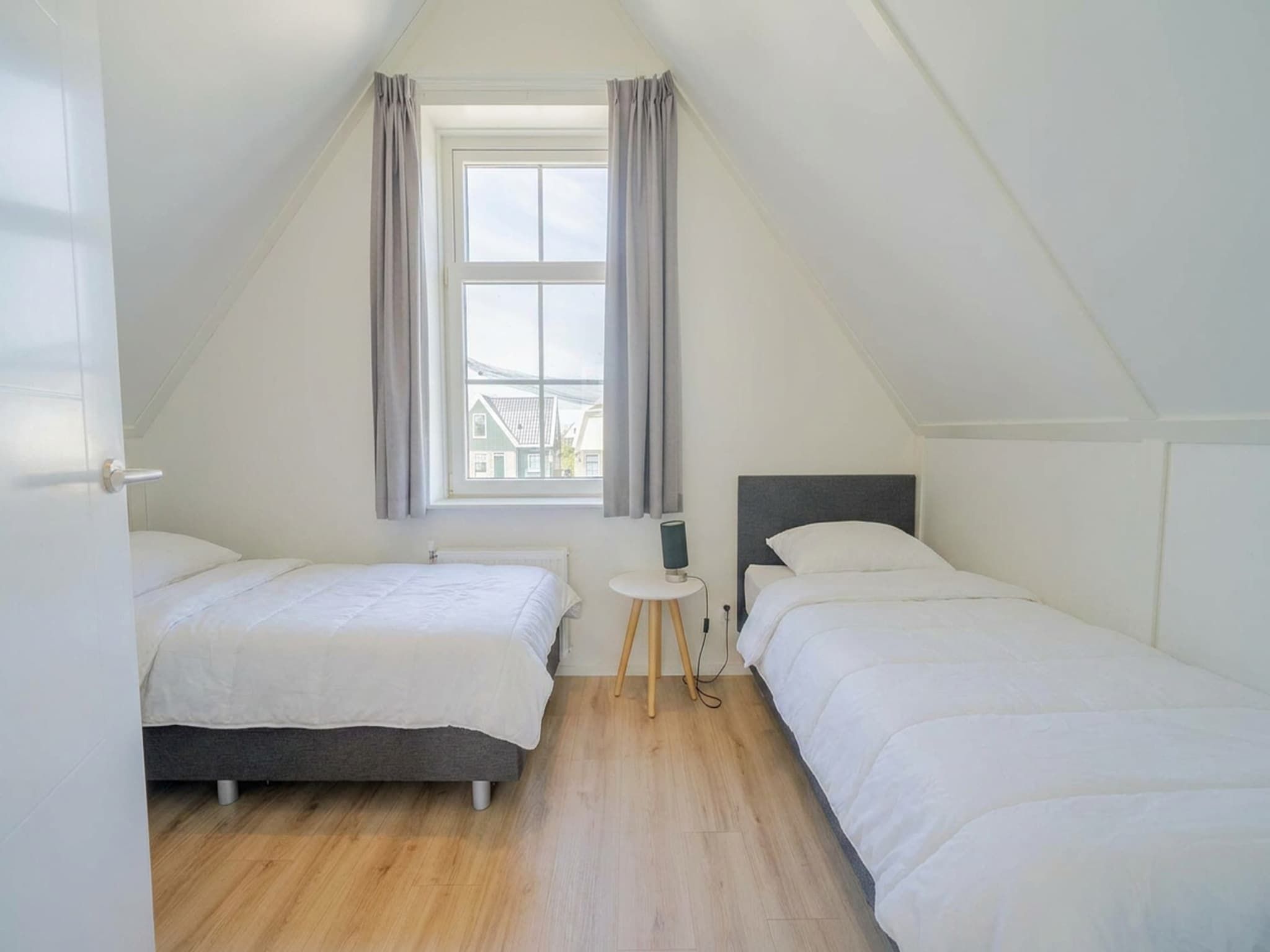 Een slaapkamer van Munt 6 in Uitdam
