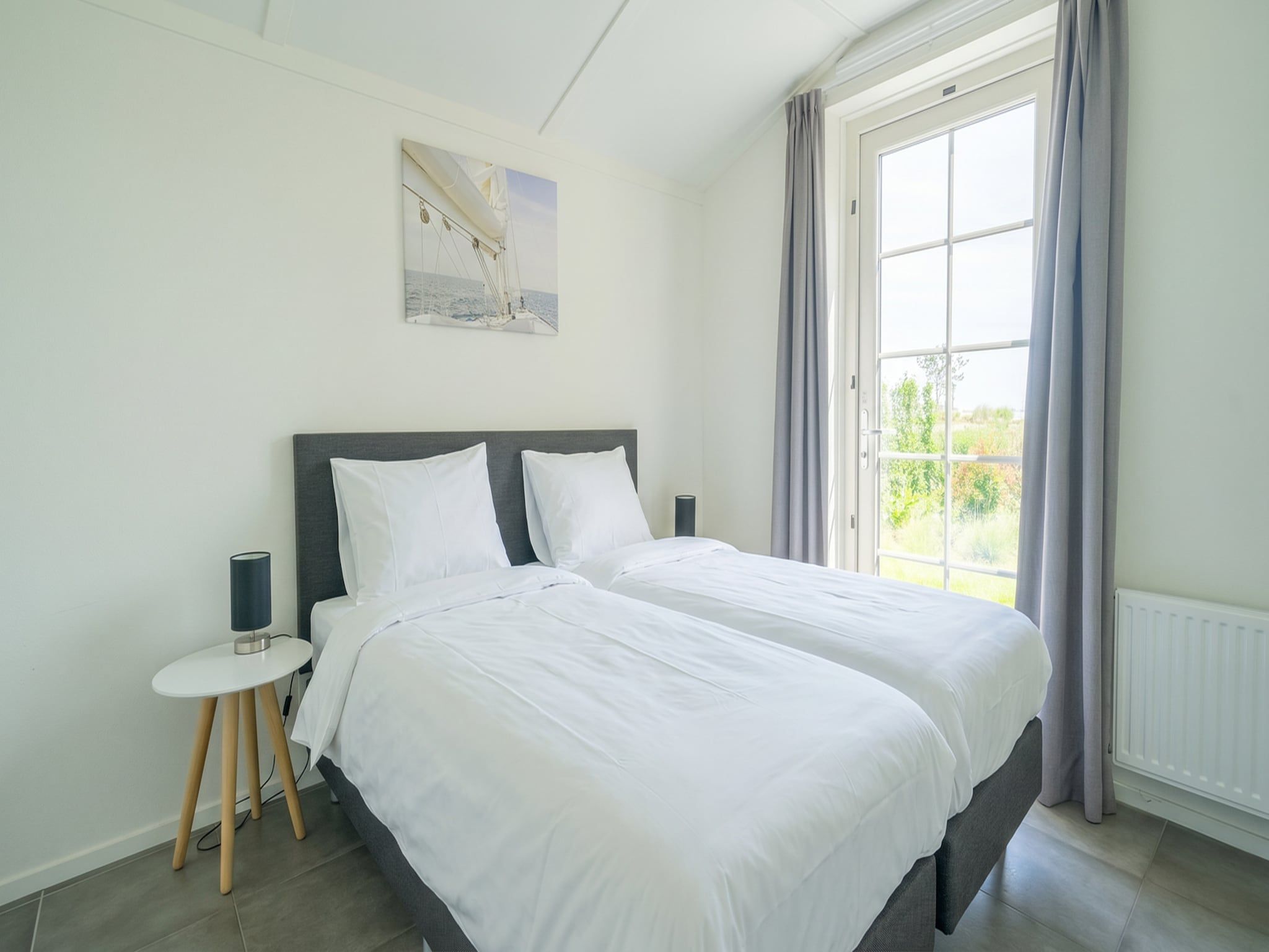 Een slaapkamer van Munt 6 in Uitdam
